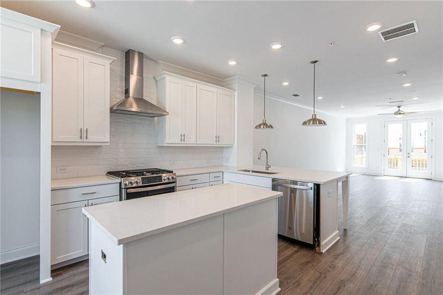 SUMMER OF SAVINGS !  ELEVATE YOUR LIFESTYLE.Come and see us , The Providence Group , Ecco park in Alpharetta ... and take advantage of our MAY  INCENTIVE ** $20,000  ANYWAY YOU WANT ** in our Barnsley I plan!  Come see this beautiful and cozy Barnsley I Floor Plan, featuring 2 Bedrooms and 2.5 Baths with beautiful views of trees and a small pond. The Front Entry is fenced and private with a covered Terrace patio, a nice sliding Glass Door and separate front door that opens up to a Flex/Media/Office Room. As you enter on the main living level you find an spacious Open Concept Family, Dining Area and Kitchen. The Kitchen has 42" upper full overlay cabinets with soft close doors & drawers and Crown Molding. The kitchen is also equipped with Calacatta Lavasa Quartz Countertops, Tile Backsplash, and top of the line GE Stainless Steel Appliances. At the 3rd level you will find the Primary Bedrooms with Tray Ceilings and a generous His and Hers Closet, a Primary Bathroom with Dual Vanity and a Walk In Shower. Second Bedroom is situated next to the Laundry Closet along with the Secondary Bath. One-car Garage with a Charger Station, extra storage space, and a driveway for an extra parking spot. Additional parking spaces can be found throughout the community. Walking distances to endless restaurants and shopping centers, dental, medical, bank and fitness facilities and just a short trip to coveted Avalon and Downtown Alpharetta areas.  The community features a landscaped wooded area, dog-friendly with pocket green spaces  and offers a vibrant vibe. Great opportunity to own in Alpharetta. This building will be ready for closing in Feb/March 2025. [The Barnsley I]