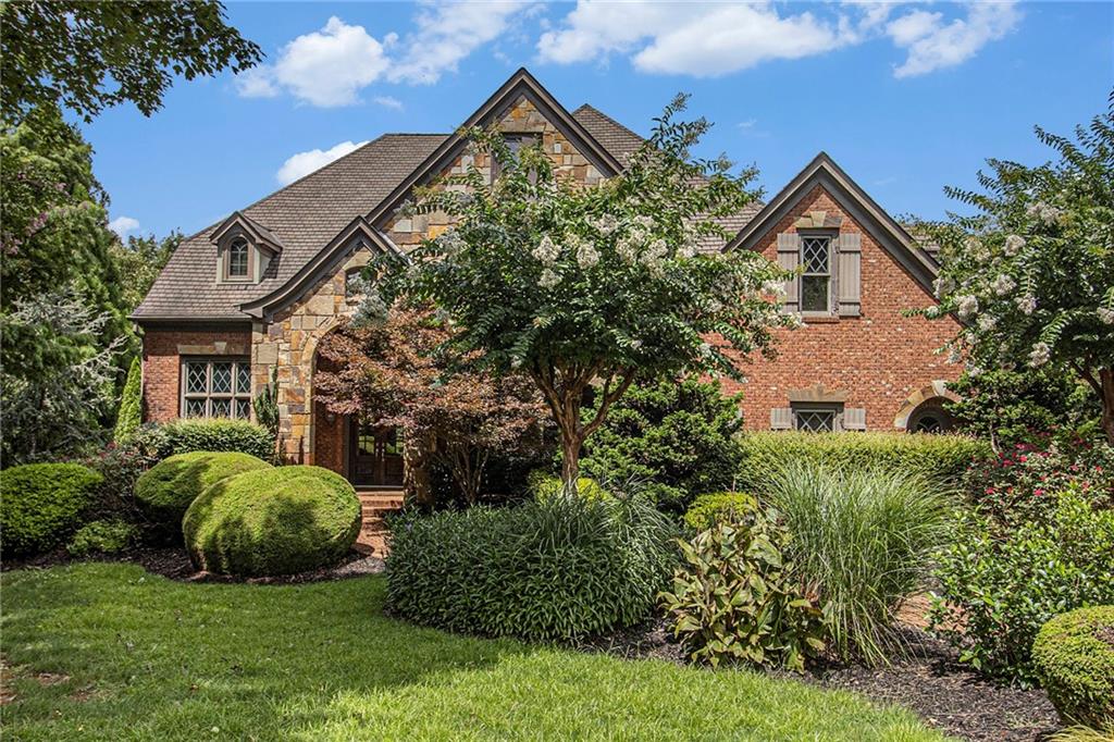 This one-of-a-kind estate offers an exceptional layout with breathtaking views, perfectly combining elegance, comfort, and modern living. Step outside to your private pool or unwind by the serene pond with its stunning fountain, all set on a generous lot surrounded by nature. Enter through the grand foyer into an expansive, light-filled space that flows seamlessly into the elegant dining room. French doors open to a charming terrace—ideal for entertaining family and friends. A sun-drenched office at the front of the home provides privacy and productivity while overlooking the street, and the formal living room with a cozy fireplace connects effortlessly, offering a perfect setting for both business and casual gatherings with picturesque views of the pool and mini-lake. The open-concept kitchen is a chef’s dream, featuring a double oven, central island with bar seating, and a spacious pantry. Adjacent, the breakfast area and family room create a warm, inviting atmosphere, complete with a second fireplace and expansive views of the pool and lake. Step into the sunroom and onto the deck to enjoy the lush, private backyard. Upstairs, the luxurious main suite offers a tranquil retreat, while two additional generously sized bedrooms with ample closet space and natural light complete this serene level. The finished basement provides a versatile living space, including a bright living room, dining area, mini kitchen, two additional bedrooms, and a flexible room perfect for a sports area, office, or guest suite. Every detail in this home has been thoughtfully crafted to enhance your lifestyle, combining luxury, functionality, and leisure in one spectacular property.
