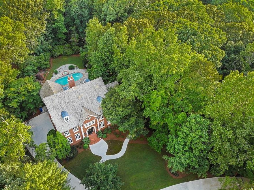 Come See Our New Look! Attention to detail & matchless construction make this Buckhead home ideal for those valuing excellence. Soaring foyer leads guests to sophisticated living areas overlooking picture-perfect backyard w/pool for entertaining. Timber beams sourced from French castle highlight bright kitchen w/dumbwaiter,Viking/SubZero appliances, endless storage. Large Master Suite is situated for privacy. Oversized secondary bedrooms, spacious terrace level w/Irish Pub inspired bar, 3000 bottle wine storage, cedar closets,slate roof, full home generator & much more.