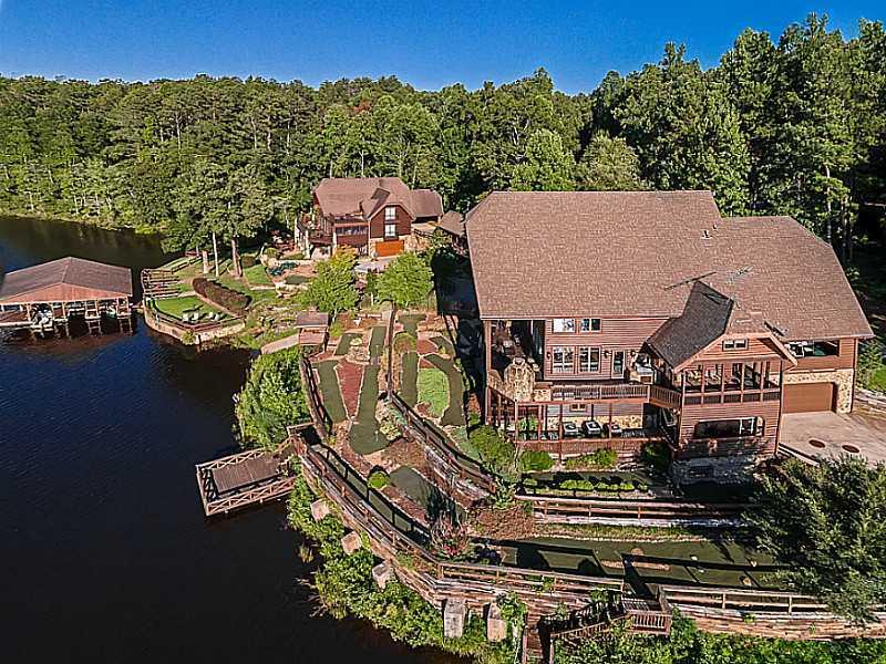 One of Georgia's finest private estate properties is now available!! This Gated, private resort has Four amazing private Lodges that sleep over 40! A full free standing dining hall/private restaurant, a separate caretaker's house, A 68+/- acre private lake for jet skiing, boating, fishing and swimming. Covered boat dock with 7 slips. A total of 361+/- acres for your enjoyment. Entertain like you've never imagined at your own private resort 1 hour 10 mins from Atlanta.