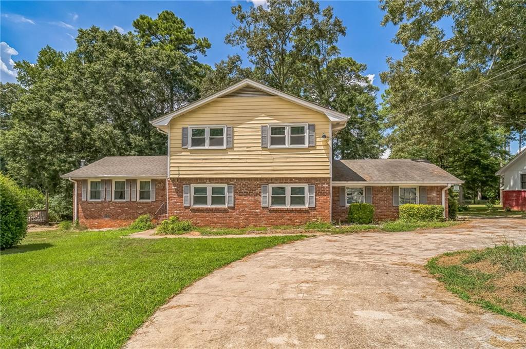 Welcome to this well maintained split-level home in Conyers! Featuring 5 bedrooms and 3.5 bathrooms this residence offers versatile living spaces to suit every need. The main level boasts an open layout perfect for entertaining, while the upper level hosts spacious bedrooms and bathrooms. The lower level features a fully finished studio apartment/in-law suite, ideal for extended family, guests, or rental income potential. The spacious kitchen is a true chef’s delight, featuring a gas range on the kitchen island and an electric range, perfect for hosting gatherings and entertaining friends and family. Enjoy modern updates throughout, including a new HVAC system (2025), hot water heater (2023), and a newly replaced roof before close. With just a few finishing touches needed, this home combines comfort, functionality, and thoughtful updates—ready for you to move in and enjoy!