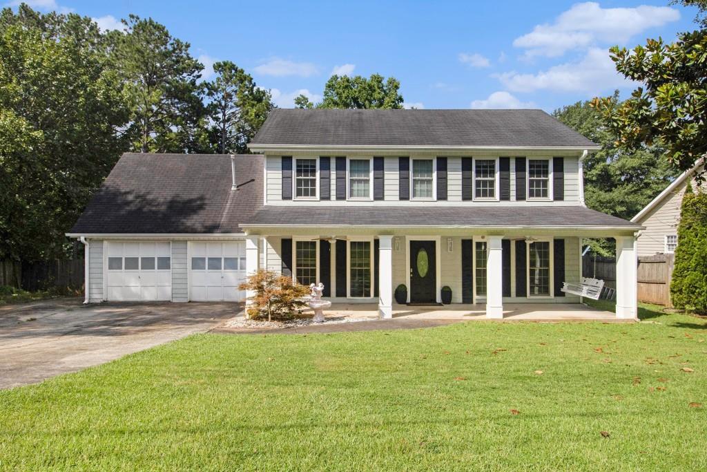 Charming Colonial-Style Home in Sought-After East Cobb! Tucked away on a peaceful, tree-lined street in the sought-after Kell School District, this move-in ready gem blends classic architecture with modern updates in an incredibly convenient East Cobb location. Situated in Lakewood Colony and just minutes from Highway 92, I-75, Downtown Woodstock, Shopping, and Dining - the location simply can't be beat. Inside, enjoy classic details like Crown Molding, Tall Ceilings, and an Abundance of Natural Light. The Fireside Family Room features Custom Built-Ins and Ample Storage, while the Spacious Dining Room flows seamlessly into an Updated Kitchen complete with Custom Stone Counters, Stylish White Cabinets, a Chic Backsplash, and Stainless Steel Appliances. A Dedicated Office Space and convenient Half Bathroom complete the Main Level. Upstairs, the Primary Bedroom retreat offers a Walk-In Closet and a Beautifully Renovated Ensuite Bathroom with a Stone Vanity, Oversized Soaking Tub, and a Frameless Glass Stone Shower. Three Additional Bedrooms share a Well-Appointed Hall Bathroom. Step outside to a Screened-In Porch that's an entertainer's dream, featuring a Built-In Bar Area perfect for hosting. The Fully Fenced, Flat Backyard offers Endless Possibilities for Play, Gatherings, or Relaxing Evenings Around the Fire Pit. Lakewood Colony offers a peaceful, amenity-rich lifestyle with a Neighborhood Pool and Easy Access to Top-Rated Cobb Schools, Parks, Shopping, Dining, and More. With so much to offer inside and out, this home is the one you've been waiting for!