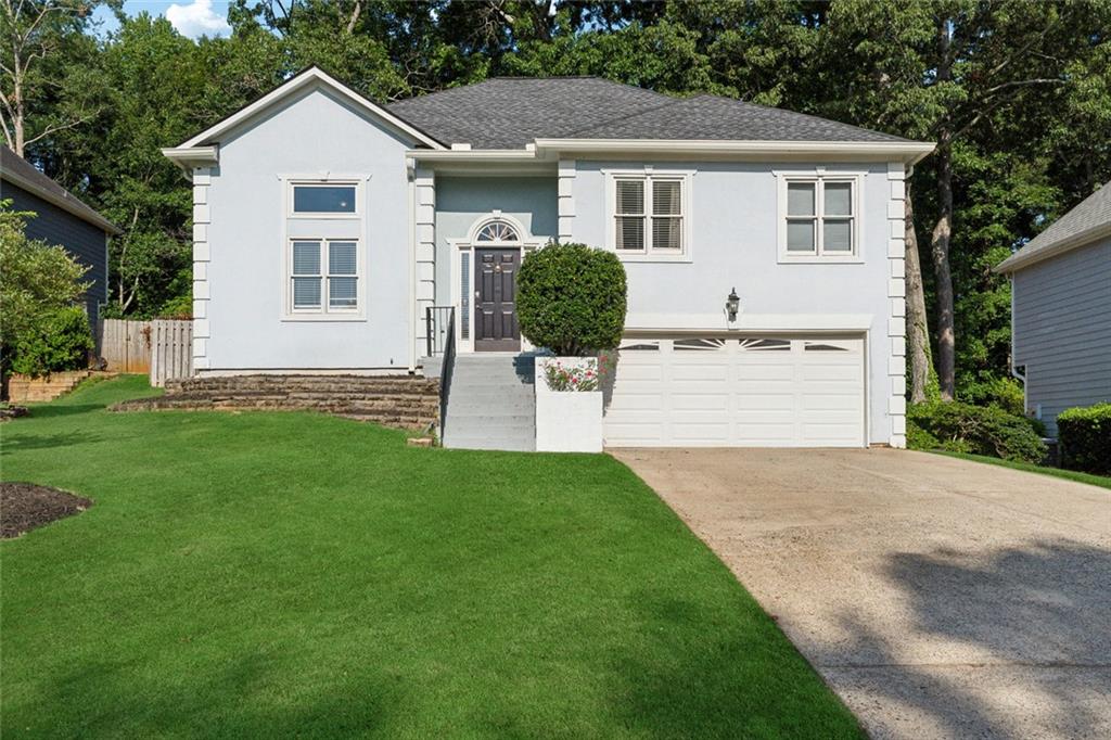 Welcome to 760 Whitehall Way in the desirable Whitehall neighborhood of Roswell. This spacious home sits on a quiet, private lot and offers a great mix of space, comfort, and versatility. Inside, you’ll find vaulted ceilings and large windows that bring in tons of natural light. The main level features hardwood and tile floors, an updated kitchen with plenty of storage, and a cozy fireplace in the living area. All bathrooms have been recently renovated with clean, modern finishes. Not to mention this beautiful home has a new roof, new gutters, and new paint inside. The finished terrace level includes its own private entrance, a second updated kitchen, another living space with a fireplace, a bedroom, and a full bath—ideal for extended guests, in-laws, or work-from-home needs. The fenced backyard features a spacious deck and offers just the right amount of privacy. Located just minutes from both Downtown Roswell and Alpharetta, you’ll have easy access to parks, shopping, restaurants, top schools, and major commuter routes. It’s a well-maintained home in a sought-after Roswell location with room to make it your own!