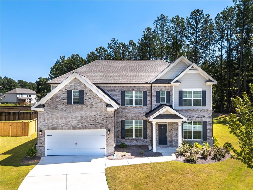 Located in the highly sought-after Mill Creek High School district, this stunning 5-bedroom, 4-bathroom home offers everything you've been searching for. Built by Century Communities, the Biltmore floor plan features a grand two-story family room with a full wall of windows, filling the space with natural light. The gourmet kitchen is a chef's dream, boasting stainless steel appliances, an oversized quartz island perfect for entertaining, and ample cabinet space. The expansive master suite includes a luxurious en-suite bathroom with a double vanity, an oversized walk-in shower with a built-in seat, and a huge walk-in closet. Generously sized secondary bedrooms provide plenty of space for comfort. Step outside to enjoy peace and quiet on your private back patio.