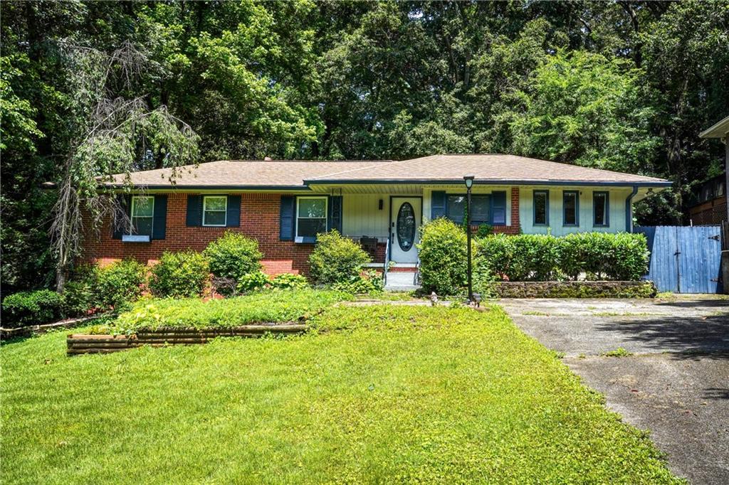 This fully furnished 3-bedroom, 2-bathroom home in North Decatur offers 1,765 square feet of functional living space with flexible layout options.
The kitchen features updated countertops and stainless steel appliances, and opens to a dining area and a sitting room. Beyond that, a light-filled addition with beamed ceilings and large windows overlooks the backyard and leads to a deck with seating and a covered sail.
All three bedrooms are located at the back of the house. The primary bedroom includes an ensuite bathroom and access to a private deck. The other two bedrooms—one with a queen bed, the other with a daybed—are separated by a shared hall bath.
A bonus room, located just beyond the kitchen, is set up as a home office and also houses the laundry closet with full-size washer and dryer. This space offers ample room for a home gym, yoga setup, or additional flex use.
The home also includes a fully fenced back yard, as well as access to an unfinished basement via side door.
