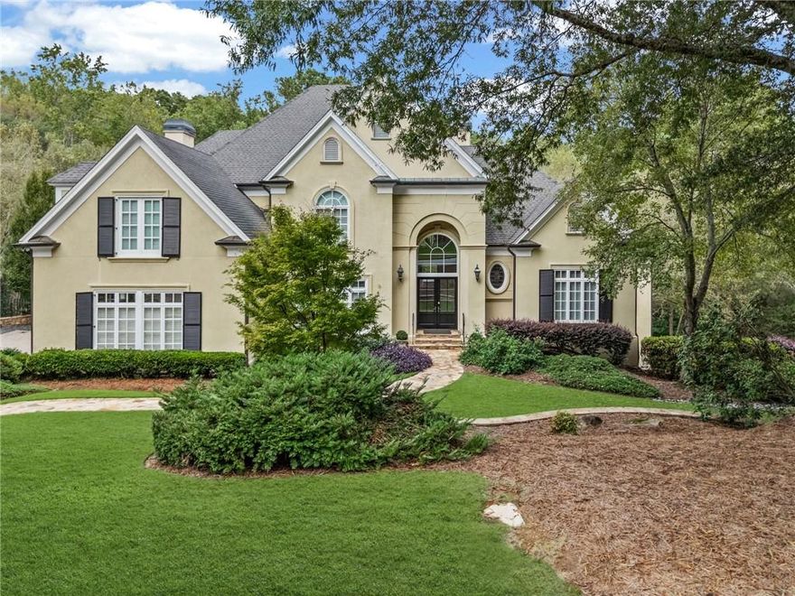 Nestled on a quiet cul-de-sac in the popular River Oaks neighborhood, 1655 Misty Oaks Drive in Sandy Springs offers the perfect blend of luxury, comfort, and location. Just a short walk to Island Ford Park and the Chattahoochee River, this elegant 5-bedroom, 4.5-bath executive home sits on nearly two acres of beautifully landscaped grounds. Thoughtfully updated, the home spans approximately 6,300 square feet of sophisticated living space designed for today’s lifestyle. The main level features a grand foyer, formal dining room, fireside family room, and a richly appointed office or study. The fully renovated designer kitchen is a true showpiece, with Wolf, Thermador, Bosch and Sub-Zero appliances, Quartz countertops, custom cabinetry with Shelf Genie pull-out drawers, and an inviting breakfast area that opens seamlessly to the family room. A beautifully appointed wet bar and butler’s pantry, conveniently located adjacent to the dining room, make entertaining effortless and elegant. The spacious primary suite on the main level offers a serene retreat with a spacious bath and custom-upgraded closets. Upstairs, 2 generous secondary bedrooms share a Jack and Jill bath while a third bedroom enjoys a private bath. The huge bonus room is a perfect children’s playroom or study center. The fully finished terrace level is designed for entertaining with a billiard and game room, media area, wine cellar, guest suite, and abundant storage. Architectural details throughout this amazing home such as coffered ceilings, hardwood floors, built-in bookcases, and multiple fireplaces add to the home’s timeless elegance. Modern conveniences include a level 2 electric car charger, central vacuum system, Generac generator, nighttime moon lights and comprehensive security features. The outdoor living spaces are equally impressive, featuring new and upgraded landscaping, fenced back and side yards, and an expansive upper deck has been refurbished and enhanced with stylish metal railings. A waterproof system under the deck creates a dry, functional patio area below, ideal for entertaining or relaxing year-round. With its combination of high-end renovations, prime location, and elegant design, 1655 Misty Oaks Drive exemplifies refined suburban living in one of Sandy Springs’ most sought-after communities.