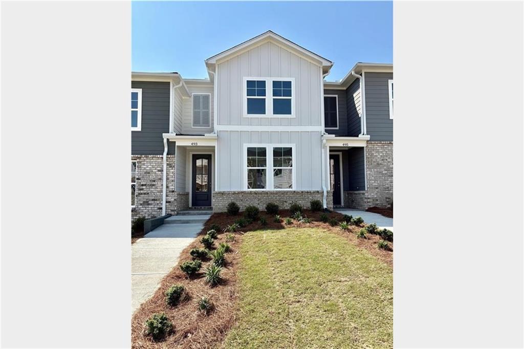 Welcome to The Monroe B in the vibrant Stegall Village, Ready Now. This 1,764 sq ft home boasts 3 bedrooms and 2.5 baths, blending style and function. Experience seamless living with a spacious, open-concept layout featuring a bright breakfast nook and living room connected to a gourmet kitchen equipped with Frigidaire stainless steel appliances and sleek quartz countertops. Upstairs, offers a loft for a great home office or upstairs den, the primary suite offers a retreat with a tray ceiling and a luxurious bath featuring a semi-frameless shower door. Two additional bedrooms provide ample space for comfort. Noteworthy upgrades include the Ponce package with 42" gray kitchen cabinets and an electric linear fireplace for cozy evenings. A 1-car garage and a 2-car parking pad offer convenience. Enjoy community amenities like a pool, clubhouse, and scenic views, enhancing your living experience. Embrace a perfect blend of elegance and comfort, and schedule your visit today! (Progress photos of Actual home. Additional interior photos are of Wilmington Model and are for illustration purposes only)
• Mountain views with quick access to I-75 compared to the competition. • Better floorplans, with our 2-story product the layouts do feel larger than the competition.
• One of few communities that offer quartz and slide in ranges as an included feature. • Clubhouse / Swim community with one of the lowest HOA fees for TH in the area.
• Discover a superior location that offers effortless access to I-75, as well as the vibrant downtown Emerson / Cartersville area —setting us apart from the competition. Our thoughtfully designed two-story floor plans provide a sense of spaciousness that truly outshines other offerings in the area. Additionally, we are one of the few communities to feature one car garages with additional parking pad for ease of entry and exit, our luxury kitchen with stainless steel Frigidaire appliances, quartz countertops and large island are perfect for culinary enthusiasts. We are an all-electric living community with stunning views of hilltops and valleys you can enjoy luxurious living without compromise. Call today for exciting new deals!