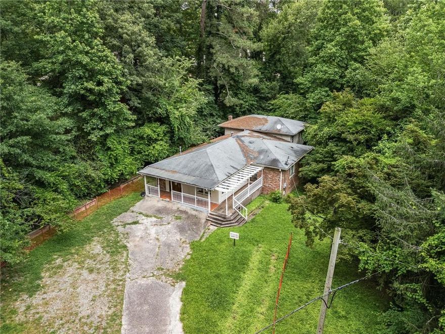 Prime Redevelopment Property for Sale with 0.656 acres located in the Downtown Overlay District of Alpharetta offering options for remodeling or tear down. Licensed General Contractor has current permits for renovations. The completed home based on builder's plans will feature 4 bedrooms, 3 full baths, a den/office, a 2-car garage, a carport, and a covered walkway. A large wrap-around outdoor living space will enhance the front entrance.  Existing home is down to the studs. Buyer can use this plan and customize the home with high end finishes. OR Buyer can purchase the lot and current home AS IS, and bring their own builder and/or plans. Home is surrounded by many high-end new construction homes. This is the perfect opportunity to purchase into the vibrant and growing Downtown Alpharetta area.