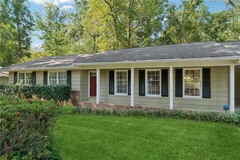 Just on the edge of Tucker, this home has the best of Tucker and Lilburn. Conveniently located minutes from both downtown centers, great restaurants, shopping, entertainment, parks, PLUS you get to take advantage of the lower Gwinnett taxes! This classic, renovated RANCH has 3 Bedrooms and 2 Baths on a finished basement. It's got a Master on the Main! Discover a thoughtfully redesigned floor plan that blends style, function, and comfort where the heart of this home is the modern, open layout! The Family Room is spacious and bright with tons of natural light, and a Dining Area that's perfect for everyday dinners and entertaining. Updates include new hardwood flooring, neutral paint colors, recessed lighting and a white-washed brick fireplace topped with a sleek wood mantel combined to create a warm welcoming living space where everyone wants to hang out. If you like to cook you'll love this updated kitchen! Featuring SS appliances, a modern farm sink with disposal, solid surface countertops, under cabinet lighting, tons of cabinet space, a convenient butcher block counter for prepping your culinary masterpieces, and a sleek new stainless vent hood over the range. This kitchen has it all plus a walk in pantry, cozy breakfast spot and a huge laundry space! (with more storage)! Refrigerator and Washer/Dryer remain with the home! Venture out to a large NEW composite deck that's big enough for grilling out, al fresco dining, star gazing and lots of room to relax on those lounge chairs you've always wanted! This inviting fenced backyard retreat comes complete with a firepit and mature azealeas, ferns and flowers! In classic ranch style, the bedrooms are down the wide hallway with a separate guest bath. The primary suite features 2 closets, and an ensuite bath with a large shower! Just when you think you've seen everything, don't miss the fantastic finished basement! Who doesn't need a craft room, storage closet for clothes, toys & decorations, a workshop, and a fully finished Man Cave/Movie Room/Play Room. There's another huge storage room with built-in shelves for all your decorations and special treasures. ADDITIONAL UPDATES include a NEW AC (2024), Crown Moulding, Gutter Guards, New Door to the Deck with built in blinds, Security Lights, and more! All the heavy lifting has been done - this beauty is ready for you! Don't miss an opportunity to make this home your own!