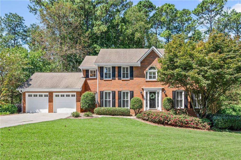 Nestled in the highly sought-after Lassiter High, Mabry Middle, and Rocky Mount Elementary school district, this vibrant community offers something for everyone, an active swim team, year-round tennis, festive seasonal parties, children’s parades, book clubs, and more!
Step inside this impeccably maintained home and you’ll find refinished hardwood floors, crown molding, plantation shutters, and thoughtfully updated finishes throughout. The spacious kitchen is a chef’s dream, featuring abundant high-end solid maple cabinetry with soft-close drawers, granite counters, stainless steel appliances and an island with additional storage. The great room is anchored by a stacked stone fireplace with premium gas logs, while recessed lighting on dimmers adds warmth and ambiance.
Upstairs, updated bathrooms offer granite counters, soft-close cabinetry and stylish finishes. The cheerful, bright, partially finished daylight basement provides flexible space for growing families, work from home needs, or recreation and entertaining. Walk-out access flows to an expanded patio complete with built-in seating and planters. The unfinished portion boasts a workshop with workbench, sink, and plenty of storage for handy, crafty buyers .
One of the true highlights is the private, wooded backyard, an ever-changing backdrop of flowering trees, lush hydrangeas, and a brilliant Japanese Maple. From the custom screened porch which is a favorite living space for all with a gorgeous vaulted, beamed ceiling to the expansive deck, this is a home designed for both quiet mornings with coffee and lively gatherings with friends.
Additional updates include new energy-efficient vinyl windows and sliding door with lifetime warranty, Hardie Plank siding with warranty, irrigation system front and back, a wide, level driveway perfect for play or extra parking, two Trane HVAC systems, oversized gutters with gutter guards and a secondary electrical panel with room to grow.
Beyond the home, Arbor Bridge is perfectly positioned for convenience, very close to schools, multiple grocery stores, restaurants, entertainment and shopping like the Outlet Mall and Costco, with easy access to the Marietta Square, downtown Roswell, and Woodstock.
This is more than a house, it’s a lifestyle complete with wonderful neighbors and activities for the whole family.