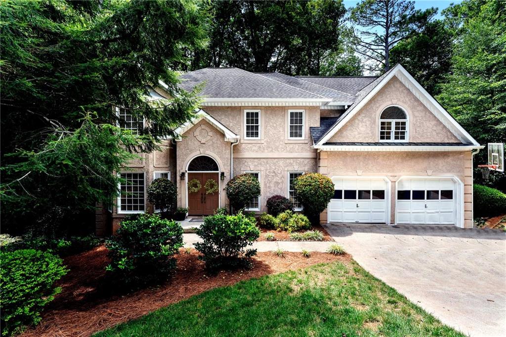 Tucked away on a quiet cul-de-sac in the sought-after Windsor Oaks community, this 5-bedroom, 2.5-bath home has the space, light, and warmth you’ve been looking for. From the moment you step into the two-story foyer, you’ll feel how bright and open this home really is.
The main level flows beautifully into the separate dining room for gatherings, and a dedicated office for work or hobbies with gorgeous french doors. The living area with built ins by the fireplace offers gorgeous views of the tree lined backyard. The kitchen and breakfast area have been recently updated with white cabinets, new fixtures, recessed lighting and the same great view of lush trees as the backdrop. Throughout the home, you’ll notice fresh paint on the entire main and upper level, all-new light fixtures, and brand-new carpet upstairs — plus freshly painted exterior trim outside for a crisp, updated look.
The primary suite is a true retreat with a cozy fireplace, a sitting area perfect for unwinding. The primary bath provides so much space for later updates down the road, while also being totally move in ready. Downstairs, the full daylight basement feels nothing like a basement thanks to high ceilings, tons of windows, and a great layout that includes the 5th bedroom with a large attached closet. There’s still plenty of storage, an unfinished area, and the option to add a third full bath if you ever need it.
Step out onto the oversized deck and once again enjoy view — gorgeous, mature trees and a private, fenced backyard that’s perfect for quiet mornings or lively weekends. There's also a flat, mulched space that's perfect for a play set, fire pit, or any other outdoor activities you could thing of. For peace of mind, the home’s hardcoat stucco (not synthetic) has been inspected, repaired, and repainted where needed.
It’s the kind of home that’s easy to move right into, but also gives you room to dream and grow. A must see gem in the swim and tennis community of Windsor Oaks- which also offers a variety of HOA sponsored events from our annual "Family Fun Day" with inflatable water slides and a DJ, to our Low Country Boil, adult only events, and even bunco and blind wine and bourbon tastings. It's not just the gorgeous home you're purchasing, it's the community you've always wanted to be a part of in this amazing East Cobb school district.