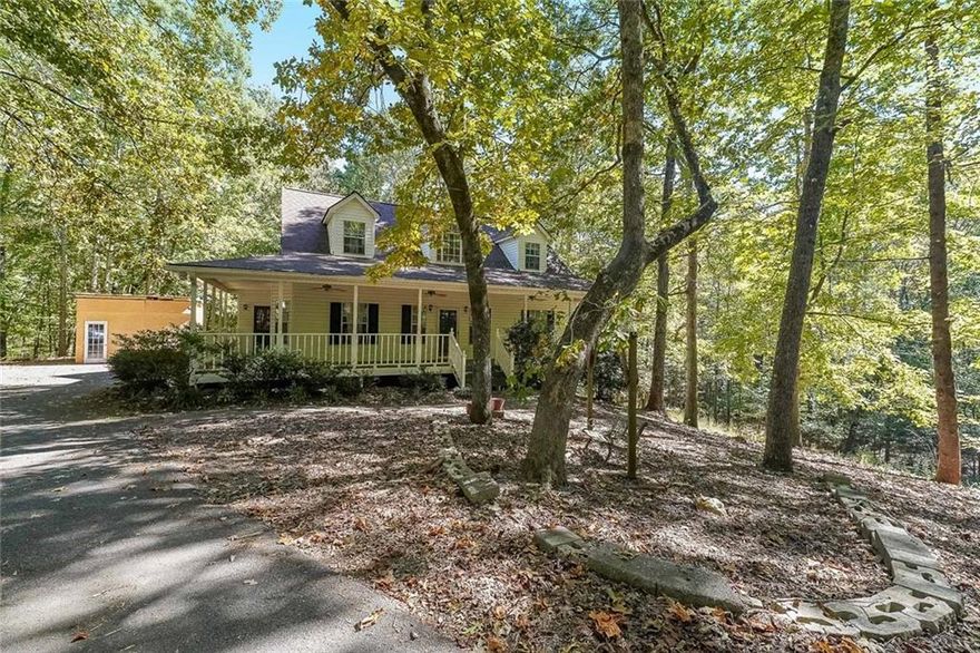 Welcome home to this stunning Cape Cod-style retreat, perfectly nestled on 5 private acres in highly desirable South Douglas County. Enjoy the peaceful charm of country living while being just minutes from local parks, dining, and shopping—with quick access to I-20 and less than 40 minutes from Hartsfield-Jackson Atlanta International Airport.

Inside, you’ll find 9-foot ceilings, spacious rooms, and oversized walk-in closets throughout. The primary suite is conveniently located on the main level, offering comfort and privacy, while three additional bedrooms upstairs provide plenty of space for family or guests.

The full basement adds incredible flexibility, featuring a workshop area for craftsmen, bonus/flex rooms, generous storage, and a separate entry—perfect for a home office, gym, or potential in-law suite.

Step outside and unwind on the inviting wrap-around porch or the oversized back deck overlooking your serene acreage. A custom-built treehouse, play area, and additional storage shed complete this property, offering endless opportunities for relaxation, entertainment, or creative projects.

With a roof that’s only 2 years old and a water heater replaced just 3 years ago, you’ll enjoy peace of mind and modern comfort in this beautifully maintained home.  Douglas County is one of the most sought-after areas to live—so make this your new home today!