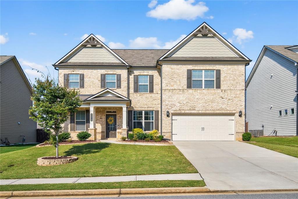 This gorgeous move in ready and like new home for sale in Flowery Branch
welcomes you with warmth and character! Facing East, you'll enjoy the
abundance of natural light flowing through this impeccable home.
Step inside to an elegant entrance foyer with a formal living and dining room
adjacent. The versatile living room is highlighted by a custom accent wall with
detailed millwork and designer paint, making it a perfect space for a home office
or study. A glamorous formal dining room with wainscotting is ready for your next
dinner party. Hardwood floors flow effortlessly from the foyer into the kitchen and
family room, where classic coffered ceilings and a warm fireplace set a
welcoming tone.
The family room opens to a chef's kitchen, featuring a large center island with
granite countertops and chic white cabinets that complement the elegant millwork
throughout. A guest bedroom and a full bath complete the convenient main level.
Step outside to the oversized patio and a well-manicured, level, fenced backyard;
an ideal spot for enjoying a cup of tea in the morning or watching the sunset in
the evening.
Upstairs, a spacious open loft provides the perfect space for a media room,
workspace, or play area. Retreat to the very comfortable master suite, which
boasts elegant trey ceilings and a luxurious spa-like bath with an oversized
shower and built-in shelving. The roomy master closet offers plenty of space.
Two additional bedrooms and a full bath complete the upper level.
Located in Lancaster, a lively neighborhood with a community pool, this home
offers easy access to shopping, dining, and I-985. You're also just minutes from
popular area attractions, including the Mall of Georgia, Chateau Elan, and Lake
Lanier Islands. Don't miss the chance to own this lovely home in a great location
and neighborhood!