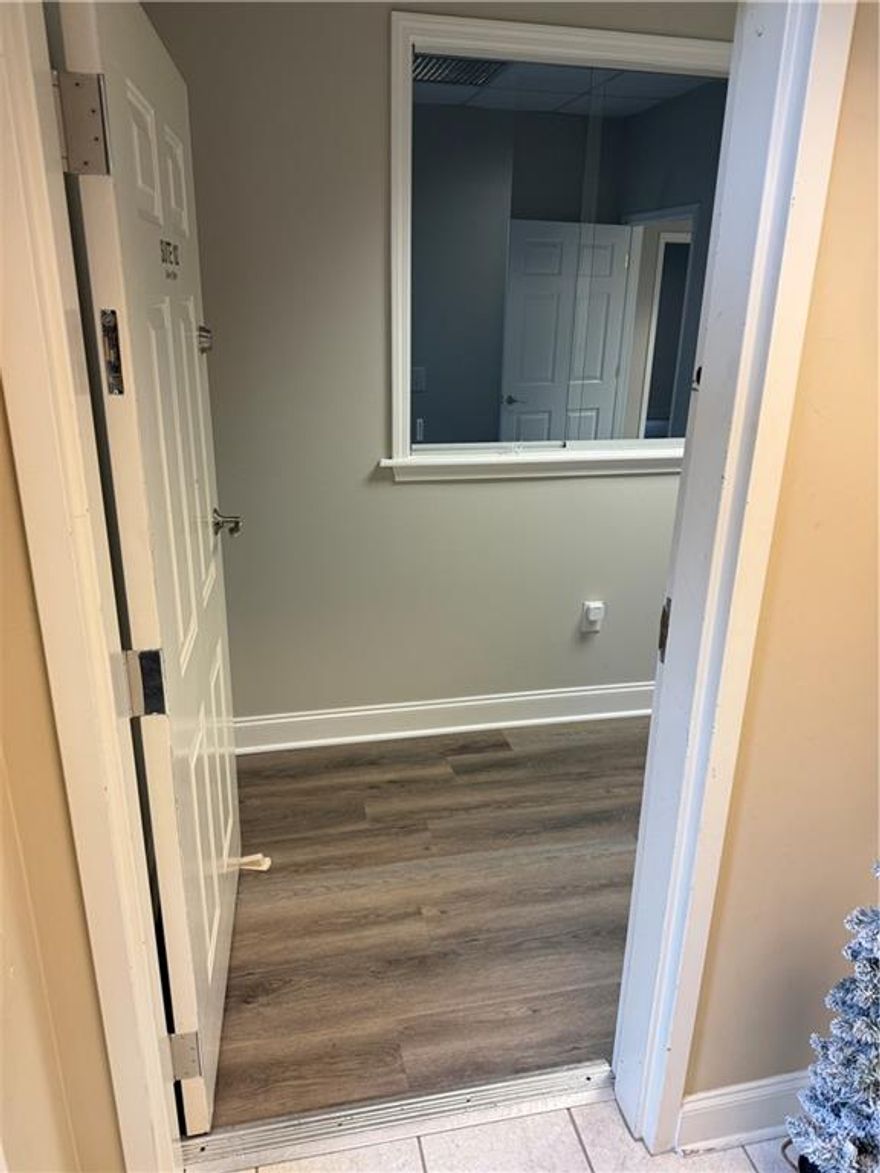 First floor fully renovated office space located just one minute away from the Historic Marietta Square! Renovation included beautiful LVP flooring, new paint and quartz countertops.  Great layout with a reception area plus four private offices, break area and private restroom (reception could be used as 5th office).  Plenty of parking available.  Building contains a law firm upstairs and counseling center as co-tenants.