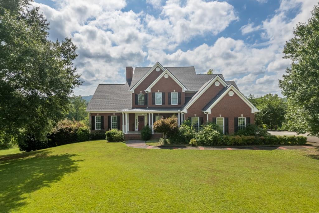 Luxury Country Retreat- Horse Farm- Check out this 4 sided brick home nestled on approx 40 Acres on Morgan Valley Rd, Rockmart GA, This beautiful home has 3 Bedroom/2.5 Bath's with huge spacious rooms through out, Living Room with tall ceilings w/Fireplace,Seperate dining room, Kitchen with solid surface counters, custom cabinets, breakfast area overlooking back yard,Master suite on main floor with large master bath w/garden tub with jets for relaxing,2 Bedrooms & large bonus room/4th bedroom share full bath upstairs, 2 sets of stairs to access upstairs.Main level also has large laundy room and office right off the kitchen area. This property also has a full unfinished basement for storage or could be finished for additional space. Property offers fencing for horses and barn, Completely private asphalt driveway leads back to a private oasis.