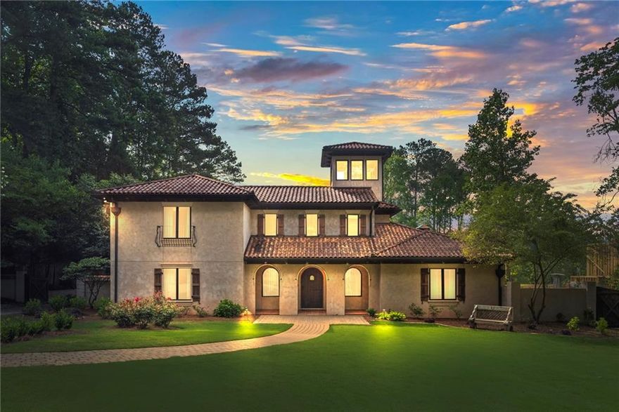 Welcome to a residence steeped in cinematic history. Located in the most prestigious area of Marietta on Woodlawn Road near Paper Mill, this luxurious gated property is truly one-of-a-kind with authentic Mediterranean Architecture and details throughout the entire home with over an acre to enjoy. It came to serve as the backdrop for the acclaimed TV series Cobra Kai after being built due to its unique characteristics and details that you will not find anywhere else. Enter through a grand two-story foyer into a spacious living area ideal for relaxation and entertaining. The center of the home is a two-story Indoor Atrium with a waterfall, walkway and large windows that connect all areas of the home. The Atrium has the most peaceful sounds with stunning design that will captivate your senses and provide natural light throughout all areas of the home. The gourmet kitchen features top-of-the-line Wolf appliances and custom cabinetry, perfect for culinary creativity. The wood burning stove is the ideal spot for pizza night. The details are fascinating! The windows above the Kitchen sink slide open to view the outdoor covered patio with beautiful two-sided fireplace where you can pass dishes or have guests sit at the bar area.  Once outside, enjoy lush landscaping, an expansive patio, a greenhouse, a sparkling heated pool and spa, as well as multiple outdoor grilling areas. If you enjoy gardening, you will appreciate the fruit trees, the sectioned off vegetable areas and open yard space.  The owner's suite on the main floor has a large fireplace, spacious sitting area, French doors to the covered patio and a large walk-in closet. The owner's bath is the most spectacular bath you will find as you can step into your pool from the bath area. The large shower features dual shower heads and a level of creativity you have to see to believe. All secondary bedrooms feature ensuite baths and walk-in closets. There is a laundry room on each floor for convenience. There is an office on the main floor tucked away for privacy. Whether you're a fan of Cobra Kai or seeking a home with a rich backstory, this property combines luxury, history, and prestige. You cannot find anything like this incredible home in Atlanta and you will not want to miss it. Schedule your private showing today and experience this iconic residence firsthand.