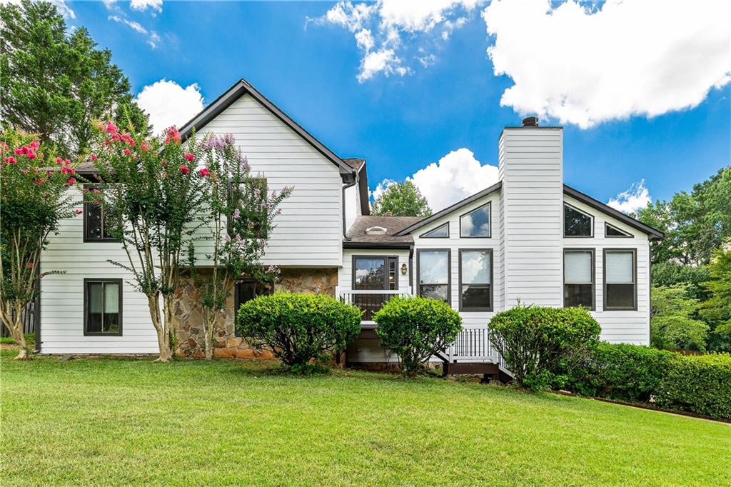 Welcome to this uniquely contemporary home in Suwanee's Taramore Farms! Set on over half an acre, this 4-bedroom, 3-bath property offers more than 2,600 square feet of living space--along with your own private in-ground pool, creating the ultimate backyard retreat. Inside, you're greeted by a warm and inviting great room featuring vaulted, beamed ceilings, a stone-accented fireplace, and an abundance of natural light. The centrally located kitchen offers granite countertops and opens to a spacious, step-down den area--complete with a wet bar, second fireplace, and direct access to the pool--ideal for both entertaining and everyday living. Additional highlights include fresh interior and exterior paint, durable Hardi-Plank siding, a tankless water heater, and lots of storage space! The community also offers a VOLUNTARY HOA membership which includes pool and tennis court. With its smart layout, custom architectural details, and resort-style outdoor living, this home is truly a rare find.