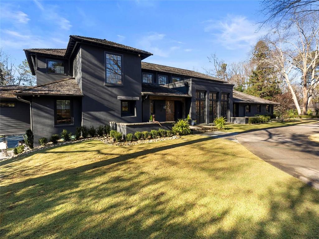 Located on a quiet street in sought-after Tuxedo Park, this sprawling California ranch-style home offers the perfect combination of understated elegance and casual living. Skillfully curated design elements throughout the home provide warmth and character including hand-hewn beams, stone & brick accents, custom lighting, and rich hardwoods. Designed to accommodate everything from the flow of daily life to entertaining on a grand scale, the recently renovated kitchen features a magazine-worthy pantry, wine closet bar area with ice maker and beverage cooler along with a suite of premium Miele appliances, Quartzite counters and a large center island. The private owner's suite features dual walk-in closets, a spectacularly remodeled spa-like bath and relaxing screened porch. Outdoor living receives top priority with a lushly landscaped turf yard, lighted pickle ball/sport court and fireside heated pool with new tile, LED lighting, spa and deck jets. Additional enviable features include an expertly finished basement with home gym and ample storage, whole-house generator, 3-car detached garage with large flex space above.
