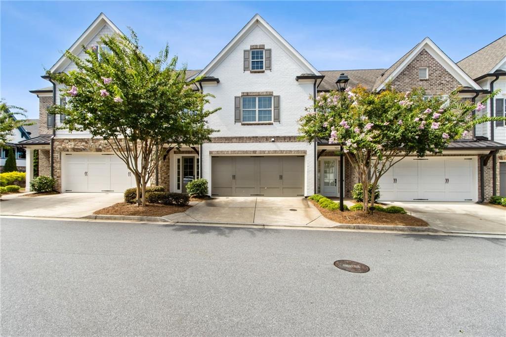 Elegant Townhome with Dual Master Suites, Elevator & Stunning Park Views! Welcome to 561 Stone Field Run, a truly remarkable townhome offering refined luxury, effortless convenience, and breathtaking views of Kennesaw Mountain National Battlefield Park—right across the street. Thoughtfully designed and meticulously maintained, this rare gem features dual master suites, a private elevator, and sophisticated finishes throughout. Step inside to discover an open-concept main level with 10-foot ceilings and gleaming hardwood floors that create a sense of warmth and grandeur. The chef’s kitchen is both stylish and functional, complete with a gas range, custom wooden vent hood, wet bar with wine fridge, and an elegant flow into the spacious dining and living areas—ideal for both everyday living and upscale entertaining. Open the doors to your private patio oasis, where a brick fireplace and uninterrupted park views set the stage for unforgettable evenings or peaceful mornings. The main-level primary suite offers an everyday retreat, featuring a spa-like bath with a soaking tub, zero-entry shower, and a generous walk-in closet that conveniently connects to a private laundry set-up. Upstairs, a second expansive master suite impresses with a massive walk-in closet and direct access to a second laundry room equipped with a utility sink. Two additional bedrooms, each with their own ensuite bathrooms and walk-in closets, provide ample space and privacy for family or guests. Additional highlights include a 3-stop elevator, abundant storage, and timeless curb appeal—all nestled in a coveted Marietta location just minutes from vibrant shopping, dining, and historic trails. Whether you're seeking elegant multi-generational living, a lock-and-leave lifestyle, or the perfect blend of comfort and sophistication, 561 Stone Field Run delivers it all in one of Cobb County’s most scenic and sought-after communities.