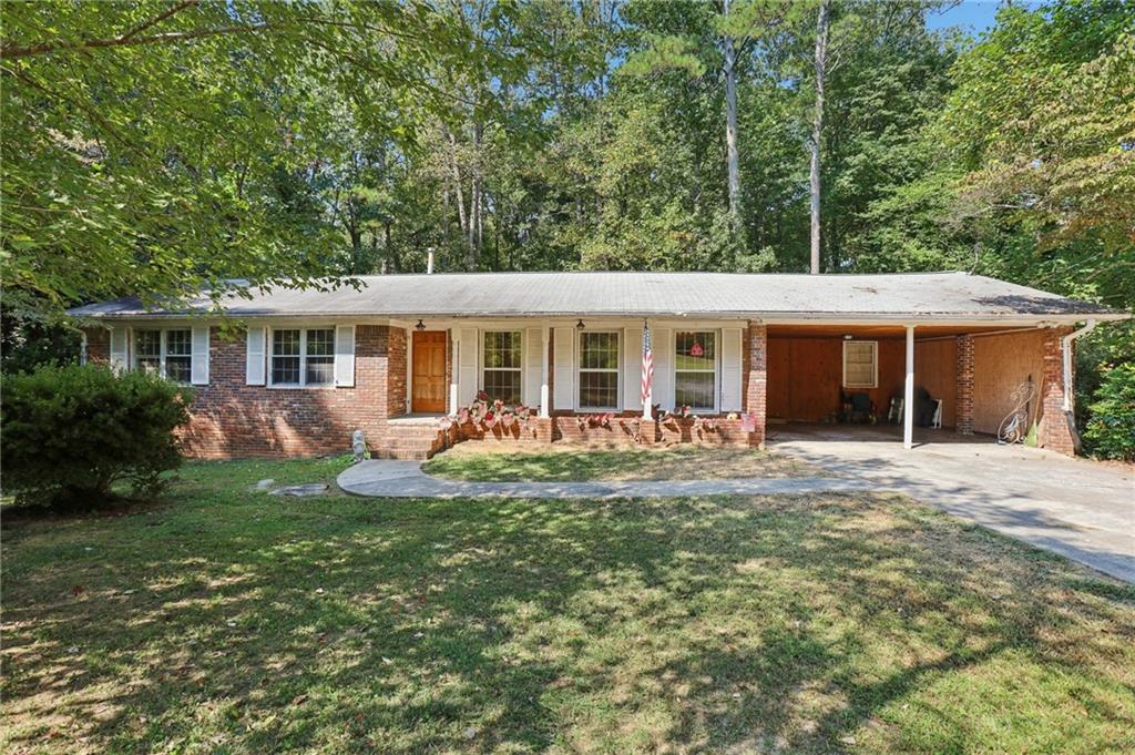 Charming ranch-style home in an established community! Inside, you’ll find hardwood floors throughout the main level—no carpet anywhere. The front room offers a bright, open space ideal for both formal dining and a sitting area. The cozy family room provides easy access to the backyard, while the kitchen features abundant cabinet space, a casual eat-in area, and a nearby laundry room for convenience. The primary suite includes a private en-suite bath, and two generously sized secondary bedrooms share a full hall bath. Downstairs, the full basement is brimming with potential—perfect for a media room, game room, home office, craft space, or playroom. Outside, relax on the back patio and enjoy wooded privacy, where you may even spot deer passing through. All this, plus a convenient location with quick access to I-75. Don't miss your opportunity - book your tour today!