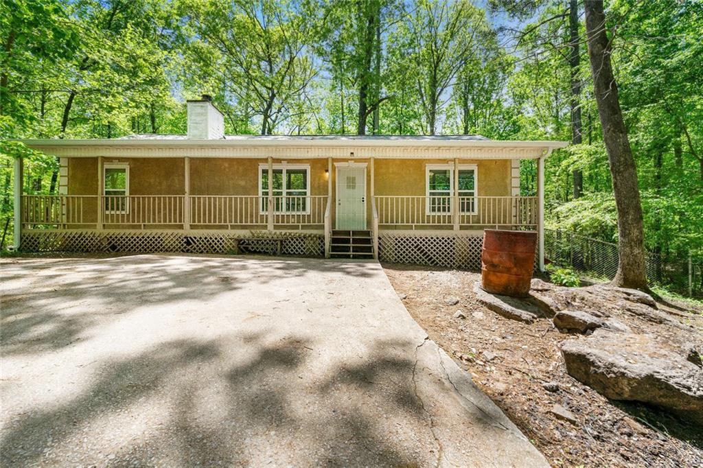 Tucked away at the end of a long, private driveway, this partially renovated 3-bedroom, 2-bath home offers peace, privacy, and a slice of country living within the city. With 1,200 square feet of single-story living space, it sits on a beautiful 2-acre lot-ideal for families, space to show off your green thumb, or anyone looking to enjoy a little tranquility. Step inside to find fresh updates throughout, including brand new flooring, windows, doors, and interior paint. The home also features a new roof, updated ductwork, and recently replaced septic lines. The HVAC system has been recently serviced, giving you comfort and peace of mind from day one. A fully fenced yard offers security for pets or little ones, with endless possibilities for gardening, entertaining, or simply soaking up the quiet country atmosphere in this lakeside community. Don't miss your chance to own this private slice of serenity with room to make it your own! Preferred lender incentives are available through Buckhead Home Loans, including up to $2,000 in lender credits toward closing costs on top of an interest rate match guarantee for all loan types and credit scores.