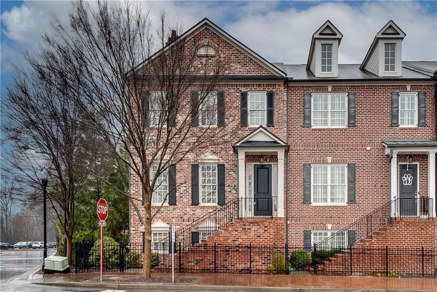 Nestled in the heart of Alpharetta's vibrant downtown Garden District, this bright and airy end-unit townhome offers unbeatable access to the city's top amenities. Just a short stroll away, you'll find an array of local restaurants, charming shops, outdoor concerts, and the Farmer's Market—everything you need right at your doorstep. This home beautifully combines contemporary sophistication with practicality. The bright white custom kitchen features stainless steel appliances, a beverage cooler, under cabinet lighting, granite countertops and a spacious island which flows seamlessly into a warm and inviting living area, highlighted by a cozy fireplace and built-in shelving, ideal for entertaining or relaxing. The oversized covered deck, located off the main living space, is perfect for grilling or hosting guests. Upstairs, you'll find three spacious bedrooms featuring customized California closets, including a luxurious owner's suite with a stunning ensuite bath offering double vanities and an oversized shower. The flexible terrace level can easily serve as an extra bedroom, a home office, or a versatile flex room—tailored to your needs with a full bathroom. The home boasts hardwood floors throughout, and the garage features fresh epoxy floors, adding both style and durability. Freshly painted and beautifully maintained, this end-unit home is a true Alpharetta treasure, offering the perfect balance of urban energy and suburban tranquility. With plenty of guest parking and lovely green space, it is a rare find in a prime location! Available rental permits in the Georgian!