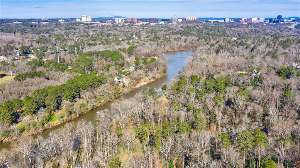 Almost 10 acres overlooking Chattahoochee River.  Original home has been torn down and work has been done so now you can build on over 2 acres.