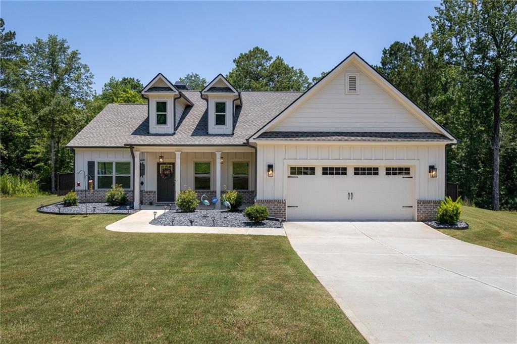 Welcome to a truly extraordinary house. This captivating home boasts a striking facade that combines both classic and modern architectural elements, drawing you in with its unparalleled curb appeal. As you approach, you are greeted by a beautifully landscaped yard, adorned with vibrant flowers, lush greenery, and meticulously manicured hedges that create an inviting atmosphere. The front entrance, featuring a charming porch, sets a welcoming tone for what lies beyond the door.
Upon stepping inside, you are immediately enveloped in a warm and inviting ambiance. High ceilings create a sense of spaciousness while allowing natural light to flood the area, enhancing the home’s airy feel. Beautifully crafted crown molding, designer light fixtures, and tasteful finishes are evident throughout the expansive living spaces, each detailing a story of thoughtful design.
The heart of the home, the living room, effortlessly merges style with functionality. Generously proportioned, it provides ample space for entertaining guests or enjoying cozy family evenings and features a brick, wood brining fireplace with a gas starter. Large windows frame picturesque views of the outdoors, allowing for seamless integration between indoor and outdoor living. The adjoining dining area is equally impressive, perfect for hosting dinner parties and family gatherings, with plenty of room for a large dining table.
Adjacent to the dining area lies a chef’s dream kitchen, equipped with top-of-the-line appliances that promise culinary excellence. The expansive granite countertops offer plenty of prep space, while abundant cabinetry ensures that all your kitchen essentials have a dedicated home, keeping the area organized and clutter-free. A breakfast nook bathed in sunlight presents the perfect spot for casual meals, providing a relaxed setting for morning coffee or shared conversations. You also have a huge walk-in pantry. No worries about storing those trips to the big box stores, you've got the space.
As you explore further, you will discover well-appointed bedrooms that provide an oasis of tranquility. Each bedroom is designed with comfort in mind, featuring generous closet space and large windows that allow for an abundance of natural light. The bathrooms are equally impressive, showcasing luxurious fixtures and finishes that create a spa-like experience right at home. The primary suite, a true sanctuary, includes a spacious layout and an en-suite bathroom complete with huge shower featuring a tile bench and rain shower head. a soaking tub, offering the perfect retreat for relaxation after a long day.
Venture outside to discover your personal paradise. The outdoor space is designed for both relaxation and entertainment, featuring a spacious patio ideal for hosting summer barbecues, al fresco dining, or simply enjoying a quiet evening under the stars. The backyard features a 6-foot privacy fence allowing for seclusion and peace of mind. The full property line extends beyond the fence line, allowing for any number of future projects or plans. This outdoor oasis is truly an extension of the home, providing a peaceful escape from the hustle and bustle of daily life.
This remarkable residence offers additional features that enhance its desirability, including a laundry room conveniently located near the main living spaces, ample storage throughout, and a garage to ensure your vehicles are protected from the elements. There is fiber internet already in place and you have a 5-zone sprinkler system to keep your lawn lush. Every aspect of this home has been designed with care and attention to detail, making it the perfect choice for those seeking comfort, style, and functionality.
