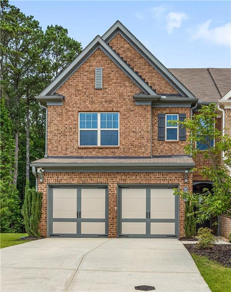 Welcome Home to your beautiful, well maintained, one owner home. 3 story 4 bedroom 3.5 bath END UNIT town home is the Chastain model. As you enter the 2 story foyer with gleaming dark hardwood floors which follow throughout the main level, it leads to open concept living. The bright kitchen is open to the family and dining room. All stainless appliances, gas stove with 5 burner grates, granite counters and tile back splash complete this space. The 4 door refrigerator, washer and dryer remain in the home. The dining and family room share a wall of windows for tons of light and overlook the wooded back yard. Cozy up next to the fireplace on cold nights. The 2nd floor has a staircase with wrought iron spindles and at the top is a large loft that can be used in so many ways. 3 bedrooms are on the 2nd level and the master is oversized with large windows, a private en suite with double vanities, soaking tub, separate shower and a large walk in closet. The 2 secondary bedrooms are large also.
The 3rd floor boasts a huge room that is the 4th bedroom or can be a teen, media, play, craft, office, or exercise room. So many options for this space. 
There is a full bath, walk in closet and TONS of floored space for storage in the attic surrounding this room. The couch, media screen and projector remain with the home. Outside you will find a nice inviting back and side yard. Great place to play or entertain. Close to GA 400, schools, shopping, restaurants, Halcyon and so much more. Don't miss out on this fantastic home that offers so much. Schedule your private showing today!