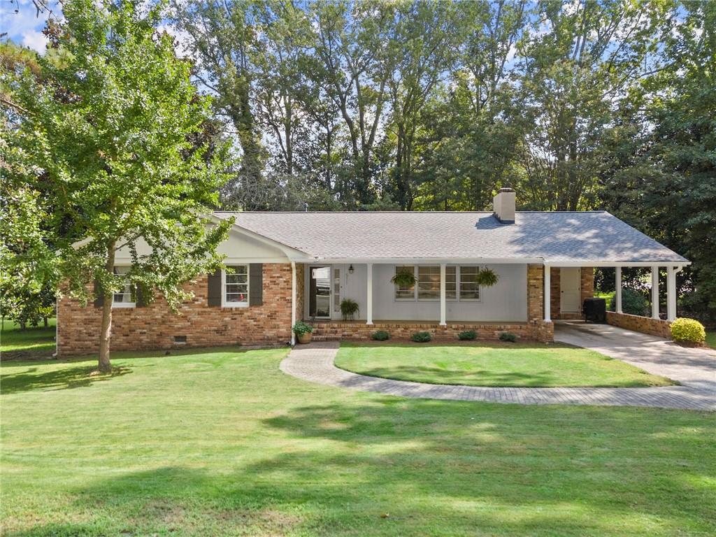 This beautifully updated 3-bedroom, 2-bath ranch blends classic 1960s charm with modern style and comfort. Nestled on a spacious corner lot in North Winder, this home offers an inviting family room with a cozy fireplace, a master suite on the main level, and an updated kitchen featuring stainless steel appliances and stylish finishes.
The home boasts large secondary bedrooms, providing plenty of space for family, guests, or a home office. Enjoy relaxing on the covered front porch or entertaining in the level, shaded yard—perfect for gatherings and outdoor activities. With tasteful modern touches throughout, this home offers the perfect balance of character and functionality.
Located close to schools, downtown Winder, shopping, and dining, this home combines convenience, comfort, and timeless appeal.