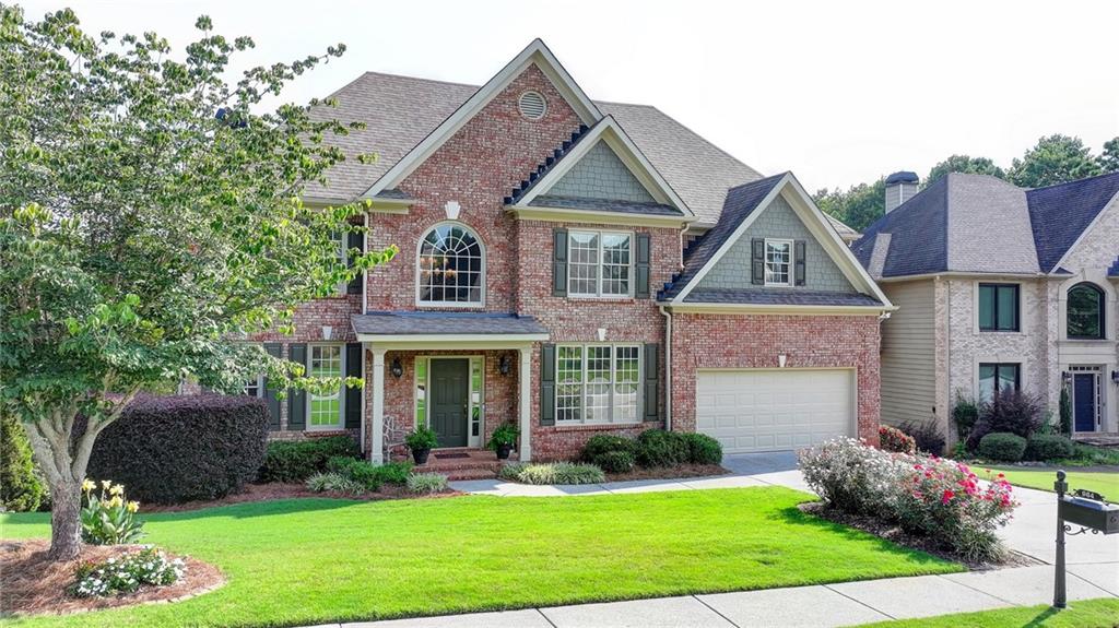 Executive style 5 bedroom, 4 and a half bath home with a finished basement located in Riverside at Apalachee Farms. The covered front porch opens to a grand two-story foyer. Beautiful hardwood floors throughout the main level. Spacious full dining room with coffered ceiling and wainscoting. Separate sitting room or formal living room. COMPLETELY RENOVATED KITCHEN features quartz counters, updated cabinets, stainless steel appliances, gas range, recessed lighting, and stainless steel ventilation hood. Large walk-in pantry. Massive laundry room off of the kitchen includes a sink and laundry shoot from the primary bedroom closet. Open concept to the breakfast area and family room. Wall of windows across the back of the house provide a stunning view of the pond, rear deck, and trees. Family room features recessed lighting, stone fireplace with gas logs, and built-in shelving. The primary bedroom suite includes a trey ceiling and spa-like bath with double vanities, whirlpool tub, separate shower, and walk-in closet with closet system. Three spacious additional bedrooms upstairs. The basement is perfect for entertaining and includes a TV room, beautiful slate floors, stone fireplace, and coffered ceiling. Wet bar with granite counters. Fifth bedroom, full bath, and a workroom/storage area round out the basement. Large back deck and underneath patio with fountain provide a peaceful setting to enjoy the view of the pond. The sought after Apalachee Farms community provides tennis courts, pickleball, Junior Olympic swimming pool, kiddie pool, hot tub, waterslide, and a clubhouse available for your next big event. Optional membership to the Trophy Club at Apalachee is just around the corner. The location is minutes to Highway 316, I85, dining/shopping at the Mall of Georgia, Hebron Christian Academy, other great local schools.
