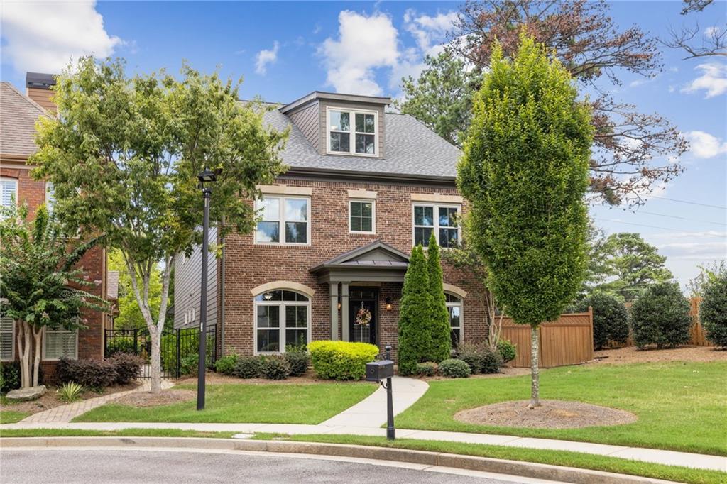 Lock-and-Leave Luxury in the Heart of Johns Creek, The #1 Ranked Community in the Country! Tucked away in the back of the gated, boutique-style enclave of Abberley Towneship, this elegant brick traditional offers the best of both worlds: the ease of low-maintenance living and the sophistication of a richly appointed residence. With access to swim and tennis amenities and professionally maintained landscaping included in the low monthly fee, 10731 Bossier Drive is the ultimate lock-and-leave lifestyle in one of metro Atlanta’s most desirable addresses. Set on a premium cul-de-sac lot that borders the neighborhood pocket park, this home feels private, peaceful, and polished. The fenced backyard offers just the right amount of green space, perfect for a game of cornhole or a sunny snooze for Luna the labradoodle. Inside, the main level delivers style and substance: a gracious foyer flanked by a light-filled dining room and a chic home office or formal living room. The fireside family room features coffered ceilings, custom built-ins, and a stone fireplace, flowing into a chef’s kitchen with rich cognac cabinetry, stone counters, stainless appliances, a custom walk-in pantry, and a bright breakfast nook. A French door opens to a covered patio ideal for morning coffee or evening wine. Upstairs, the oversized primary suite is a true retreat, with a cozy sitting room, walk-out balcony overlooking Morton Park, and a luxe en-suite bath featuring a whirlpool tub, double vanities, and a separate shower. The showstopper? Two massive, custom-designed walk-in closets, a rarity at any price point. Three additional bedrooms on this level include one private en-suite and two guest rooms that share a Jack-and-Jill bath, perfect for guests, teens, or visiting grandbabies. On the third floor, a fully finished flex space with full bath can serve as a fifth bedroom, rec room, media lounge, or playroom. Recent upgrades include: Newer roof with Daikin variable-speed compressor (lifetime transferable warranty)
Shumate Signature Daikin Fit Series HVAC (2021) with 12-year parts & labor warranty + smart app control, Triple-pane energy-efficient windows with lifetime warranty, Galvanized steel roof enhancements for durability, Transferable termite bond with Northwest Exterminating, upgraded lighting throughout, custom kitchen pantry, fresh landscaping and updated irrigation system in the backyard! Behind the gates of Abberley Towneship, you’ll find a posh, peaceful, and perfectly positioned Johns Creek gem. Just minutes to Avalon, award-winning schools, and the vibrant energy that earned Johns Creek the #1 spot on Newsweek’s “Best Communities in America” list.