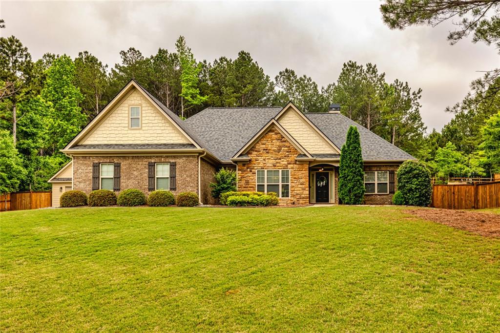 Beautifully Updated Home Near Thomas Crossroads - Prime Location Close to I-85, Shopping & Top-Rated Schools. Welcome to this meticulously maintained home offering stylish updates and functional features in an unbeatable location. Situated near Thomas Crossroads and just minutes from I-85, this property combines convenience, comfort, and craftsmanship. A Newly constructed 2-car detached garage with recessed lighting, EV hook up, 220 panel, and an upstairs loft-perfect for storage or a future finish. An Expansive fenced-in backyard with new sod, ideal for outdoor entertaining or family fun. A Large covered back patio featuring a fireplace and a freshly poured concrete pad-an entertainer's dream. Inside one will love the Single level living with the primary suite on the main floor. Elegant formal dining room with beautiful molding. A Spacious vaulted family room with a cozy gas fireplace. Fresh paint and new lighting throughout. New HVAC systems and hot water heater for peace of mind. With Stylish new countertops and backsplash in the kitchen, Built-in cabinetry in the breakfast nook, Stainless steel appliances and new can lighting for a bright, modern finish. In the Primary Suite one will love the Tray ceiling, abundant natural light, and newly installed carpet, the Spa-like bathroom with new countertops, light fixtures, and a custom closet system. Continuing on the main floor are Two additional bedrooms and a full bath on the main level with new flooring and countertops. Upstairs you'll find a spacious 4th bedroom or bonus with a full bath, and new flooring-great for guests or a home office. Every detail has been thoughtfully updated to create a move-in ready home that balances comfort and style.