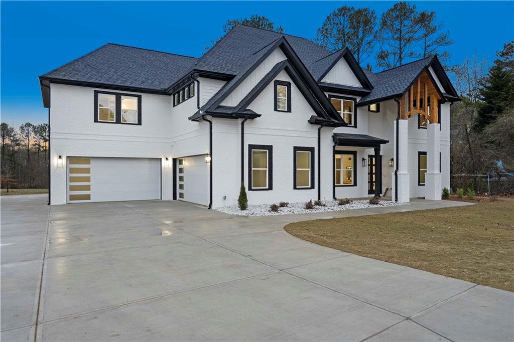 The buyers financing fell through! This home is in pristine condition. Their loss is your gain. Another beautiful Nick & Brothers brand new construction property is ready for you to enjoy. This gated entry home sits amongst a small enclave of residences that you can fully fence for ultimate privacy. This Cornel floorplan has been upgraded with gleaming chandeliers and light pendants that adorn the home, accent walls that elevate and anchor the sun filled open concept main level.  White porcelain tile with marble design detailing is perfectly laid throughout main level. The chef's kitchen is equipped with a 6-burner gas cooktop and a walk-in pantry. The waterfall quartz countertop has a striking contrasting marble vein design- a the perfect centerpiece for you to enjoy entertaining friends and family with views to your family room and a fireside covered patio. The Guest Suite is tucked away on the main level with a stunning frameless shower and its own laundry hookups quite the accommodating feature. On the Upper level, you’ll appreciate the oak hardwood flooring and your expansive loft space- the perfect location for a second family room. The Owner's Suite is plush and palatial; designed with tray ceilings and a cozy fireplace just to start. Enter into a bathroom of pristine provisions; the floor-to-ceiling porcelain tile shower with double shower heads, a rain shower head, and a standalone soaking tub this room is a grandiose retreat. The luxe designs continue into the generously sized custom walk-in closet, adorned with gorgeous lighting and an island that is not only eye-catching, it has drawers for added storage. Situated just across from Little Mulberry Park - a scenic park with soft-surface trails for horses & hikers, plus a fishing lake & disc golf course. Less than 15 minutes from Chateau Elan Winery Golf Club and Resort. And built in an above-average school system, this location is prime! This property exudes convenience in every sense with the excellent location, great floor plan, and incredible price. This move-in ready custom built new construction home is just waiting for you to make it your next home.