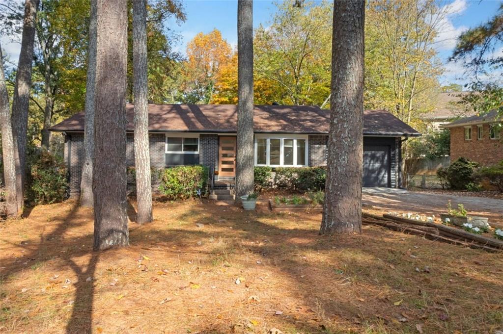 UTILITIES INCLUDED except internet. Fantastic renovation which includes gorgeous kitchen with quartz countertops with waterfall side. Custom tile backsplash, new flooring, under cabinet lighting, new stove, plenty to cabinet space and open shelving and opens to light and bright sunroom. Sunroom features tons of windows to provide natural light and opens to your new deck overlooking your private backyard. The main level bathroom is oversized and features steam shower/tub, new flooring, new vanity, new commode, hardware, lighting and mirror. The master bath is one of a kind and features walk-in shower, beautiful, oversized porcelin tile, gorgeous lighting, new vanity and commode. The terrace also features a large finished space that can be utilized as a playroom, exercise room, home office or whatever you can dream of. There is an additional huge unfished space in the terrace level that features a half bath, additional separate entrance, storage space and laundry. This space could be used as a separate office space as well. Situated on a huge, private lot. Lots of space for additional cars in the oversized, extended driveway. Minutes to Downtown Decatur, Toco Hills and Northlake Mall. Walking distance to schools, restaurants and shopping. There is a separate one bedroom basement apartment that closes off completely from the main house that is currently rented.