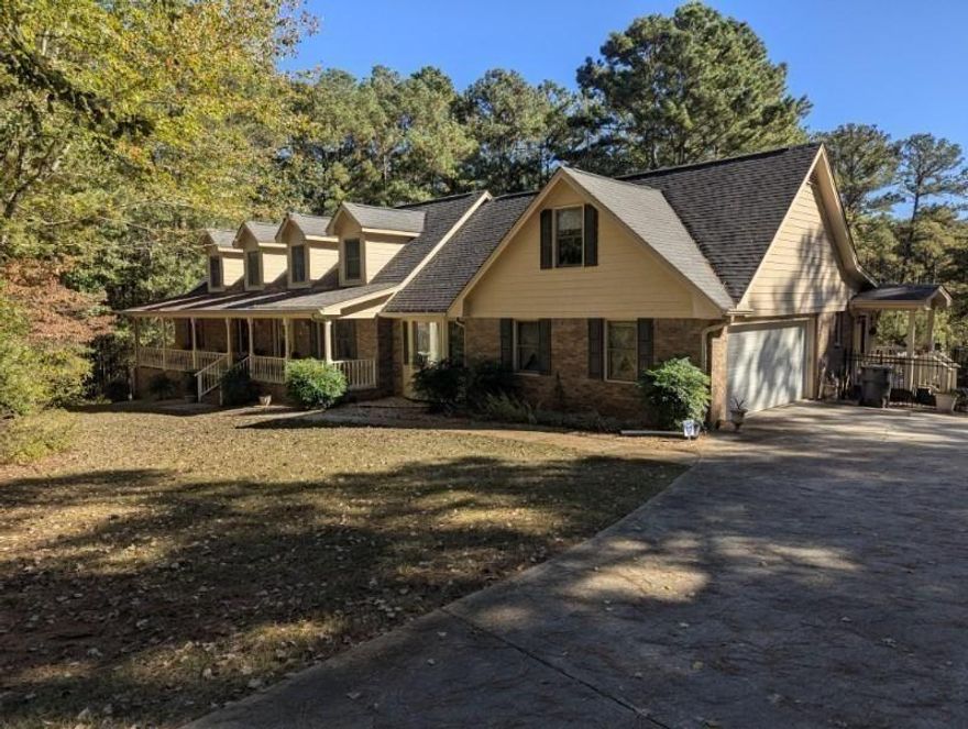 Honey Stop The Car! This property is nestled in the heart of Rockdale County. Welcome to your private paradise and oasis gated 5 + acres luxury estate with multiple spacious rooms offering the perfect blend of land, luxury, and lifestyle with pure tranquility views of a resort-like feel with a ground-heated salt water pool and hot tub. It is the perfect blend of a luxury lifestyle with privacy and plenty of space— it’s all here, ready for you to call home. Imagine evenings spent on the porch, enjoying the peace of the surroundings, or hosting gatherings on the patio, perfect for entertainment and everyday living. Primary suite on the main boasts a private sitting area, spa-style bath, and sunlit views of the courtyard and pool. Upstairs a second family room and an additional master suite provide flexibility for guests. Freshly painted and move-in ready, ideal for multi-generational living. Step inside to find and enjoy a spacious family room with a gas fireplace and custom built-ins, gleaming hardwood floors, a chef’s kitchen with granite countertops, double ovens, and an inviting charming breakfast area overlooking your private backyard hidden gems. There is a detached garage with full game room and workshop offers versatility and fun that can be utilized for extra storage. Multiple porches, including a screened sunroom and porch extending the living space outdoors and peaceful surroundings. Backyard space includes a covered pavilion with a wet bar and retractable TV. Lush Landschaping thoughout is filled with blooming plants, apple and pear trees, blueberry bushes, this property provides true privacy just minutes from Conyers new restaurants, shops, and exciting development. Offers a solid foundation for creating lasting memories. A property ready to be transformed into your dream home.