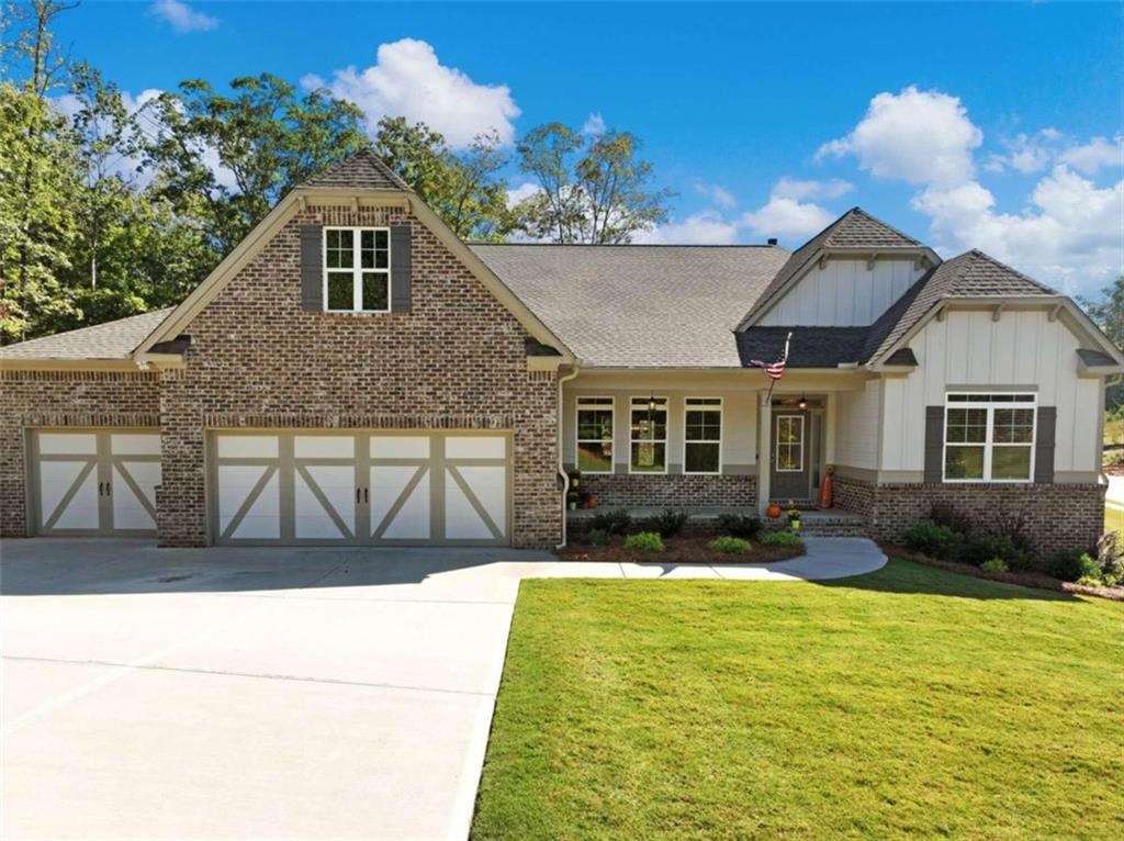 This open floor plan ranch home is waiting for your finishing touches. Better than new with $70,000 in extras and upgrades for your enjoyment and no waiting for it to be built. Move in today! This is the Kenleigh plan built by EMC homes. Located in desirable gated lake community with clubhouse, pool, playground, offsite boat/RV storage and close to public boat ramp and all that Gainesville has to offer with restaurants, entertainment and shopping. Great location and short drive to north GA mountains, GA 400 and outlet shopping on GA400. Come see for yourself how the additions and upgrades to this home when built make it the best value on the market today.