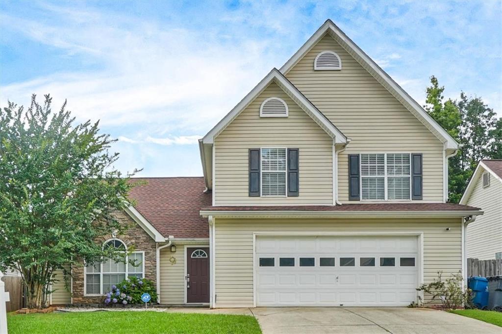 Don't miss this incredible opportunity to own a home in the highly desirable Winnsong Chase subdivision-known for its charming atmosphere, welcoming community, and convenient location. This spacious and inviting home features an open floor plan with soaring ceilings in the living room, creating a bright and airy ambiance. The modern kitchen, complete with ample counter space and updated appliances, opens seamlessly to the living and dining areas-perfect for entertaining or everyday living. The main level includes a bedroom and full bathroom, ideal for guests, multigenerational living, or a private office. Upstairs, you'll find three generously sized bedrooms and two full bathrooms, providing space and flexibility for any lifestyle. The primary suite is a true retreat, featuring abundant natural light, a large walk-in closet, and a luxurious en-suite bathroom with dual sinks, a soaking tub, and a separate shower-perfect for unwinding at the end of the day. Situated in a prime location, this home offers easy access to top-rated schools, shopping, dining, and major highways. Experience the perfect blend of comfort, style, and convenience in one of the area's most coveted neighborhoods. Schedule your private tour today and make this exceptional home yours!