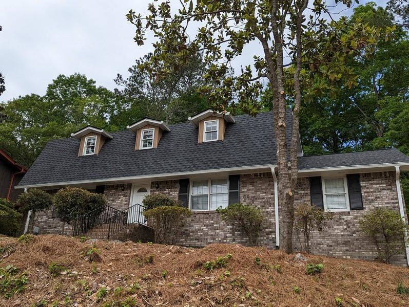 Are you tired of paying rent and looking for an updated home that doesn’t break the bank? Well, here is the perfect opportunity for you. This home is located in the very popular Ponderosa neighborhood, which is an architectural delight with each house being completely different (contemporary, mid-century, etc.) and located within minutes of I-85, shopping, airport, downtown, eateries, and parks. The home sits perched up on the lot with a large, level backyard with plenty of mature trees providing shade and privacy. A bonus room (sunroom) sits off the carport and overlooks the backyard, perfect for an office, media room, or man cave. Enter the home and you will find an eat-in-kitchen with new cabinets, custom tile, and granite. A laundry room is located off the kitchen with storage space. A separate dining area and family room are adjacent to the kitchen. The family room features a huge stone fireplace (wood burning), vaulted ceilings with beams, and beautiful original woodwork. & panels. The owner’s suite is located on the main level with a tiled bathroom, dual vanity, and granite. A beautiful foyer entry leads you upstairs, offering two large guest bedrooms and an updated guest bathroom with granite & dual vanity. The roof is new, the exterior paint has been redone, and the HVAC has been serviced. You will love this home and its location! Make this home yours today and start entertaining guests and family for the up-and-coming summer season.