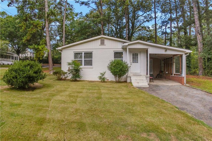 Welcome home to this charming bungalow just minutes from I-75, I-575, I-285, and vibrant downtown Marietta. Inside, you'll find two spacious bedrooms plus a versatile bonus room that could easily serve as a third bedroom, along with a beautifully updated bath—perfect for relaxing after a long day. The kitchen, with its rich stained cabinets, flows seamlessly into the open dining area and family room, creating a bright and welcoming space for everyday living and entertaining. An attached 1-car carport adds extra convenience, while the home's fantastic location keeps shopping, dining, and major commuter routes right at your doorstep. No pets.