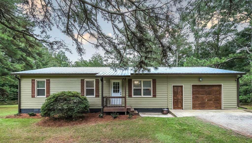 This charming home features 2 bedrooms (easily convertible back to 3) and 2 full baths, all nestled on 1.11 serene acres. With multiple storage buildings, there's plenty of room for your hobbies, tools, or even a few farm animals. Whether you're tinkering in the workshop or enjoying the quiet of country living, this cozy property has that warm, welcoming feeling that just says home!