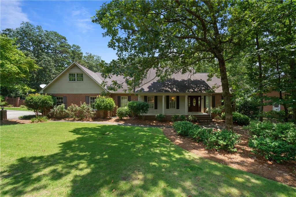 Welcome to this stunning all-brick estate nestled on a desirable corner lot in beautiful Rome. Boasting 5 spacious bedrooms and 3.5 baths, this home offers the perfect blend of elegance and comfort. The main level features a luxurious owner's suite, rich hardwood flooring, and an open-concept kitchen with a large island—ideal for the home chef and perfect for entertaining. Enjoy cozy evenings in the expansive family room with a fireplace, host gatherings in the formal dining room, and relax in the additional living space that adds versatility to the layout. A generous laundry room adds practicality to everyday living.
Upstairs, you'll find four large bedrooms and two full baths, providing ample space for family or guests. Step outside to the covered back porch and take in the beautifully landscaped yard, fully enclosed by an all-brick privacy fence. The backyard is your personal retreat—featuring an inground pool, pool house, and a private deck perfect for lounging or outdoor dining. Electric Vehicle Charger in Garage.
This home offers timeless curb appeal, thoughtful design, and resort-style living right in the heart of Rome. Don’t miss the opportunity to make this rare gem yours!