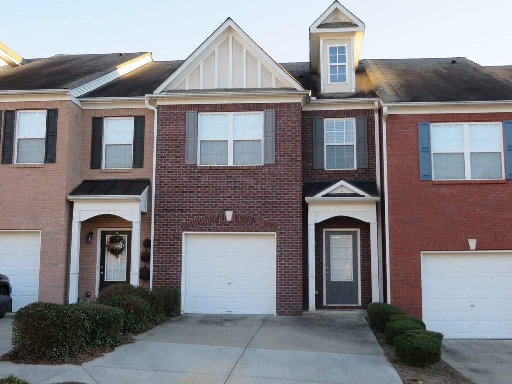 **** Available 10/6/2025. Pets are not allowed **** Just minutes from I-85, Hwy 316 and 120 and shopping. Upscale townhomes with two large bedrooms and two full baths upstairs, half bath on main floor. Open floor plan with view to kitchen and dining area. Family room has a gas fireplace. Attached garage with extra parking pad. Well maintained unit.