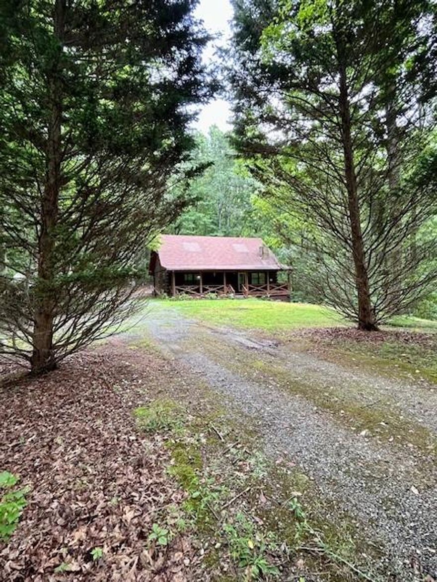 Looking for peace and quiet away from it all?? Privacy, Serenity? THIS IS IT! Rustic Cabin with tons of character situated on 30 acres with abundant wildlife! 2 bedroom with oversized bonus area that is perfect for 3rd bedroom, Great room with soaring ceilings and gas wood stove, Beautiful Heart of Pine wood flooring and wall covering, rocking chair front porch to enjoy sipping morning coffee while listening to the birds chirp, exterior entry unfinished basement, Small creek which could be dug out to access the natural spring on the property. Would make perfect hunting lodge or corporate retreat!