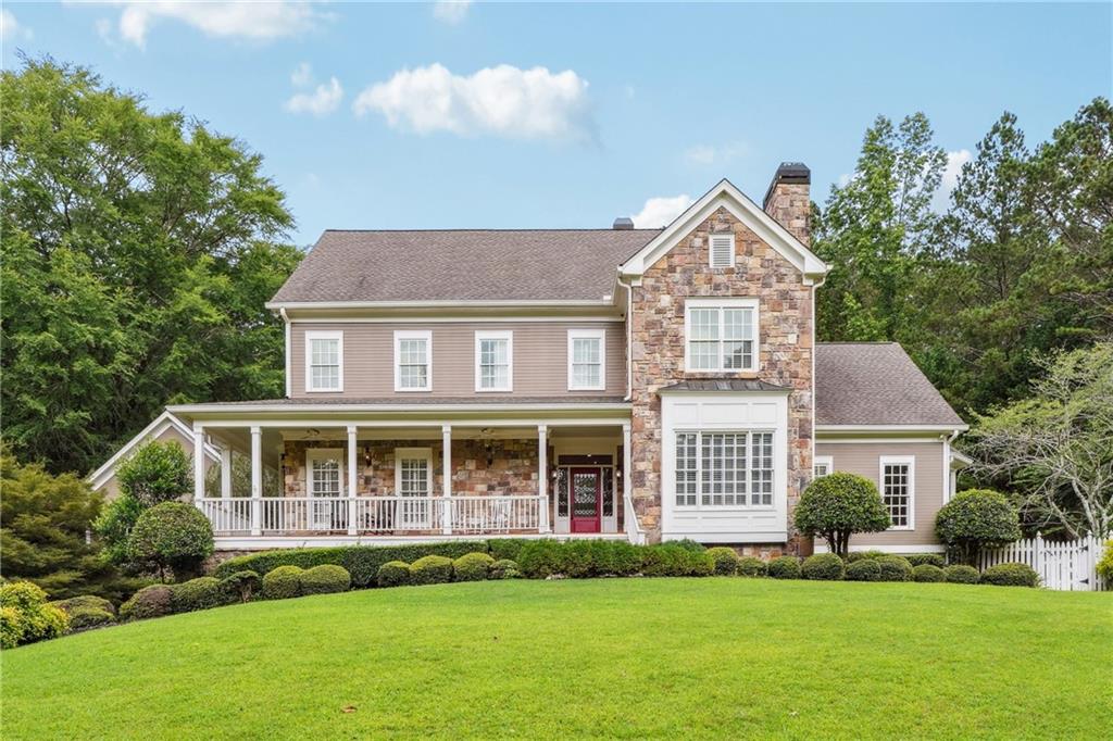 Ultra rare opportunity. This large executive home sits within a small, private gated community for just a few homes. The property sits on 2 acres and has enormous grounds with a long driveway leading to a 3 car side-entry garage. The fenced yard has a seperate, private screened gazebo as well as exquisite inground custome salt-water pool with spa and enormous deck for entertaining. This executive home has all you could ask for: Great Cherokee County schools, 2 Acres in the heart of Milton, beautifully landscaped gardens and much more. Walk inside to walls of windows overlooking beautiful grounds and bright light. New kitchen w high end appliances, fireside keeping room & breakfast area, huge mudroom off garage. Updated master suite and bath on main, four bedrooms up with private baths (2 jack n Jill baths), and one bedroom w private bath. Terrace level Media Room, Office and bedroom/bath. The pictures do not show that the ENTIRE home is hardwoods. there are no carpets or tile as those have been replaced with hardwoods. Year-round pool services are included with the lease.