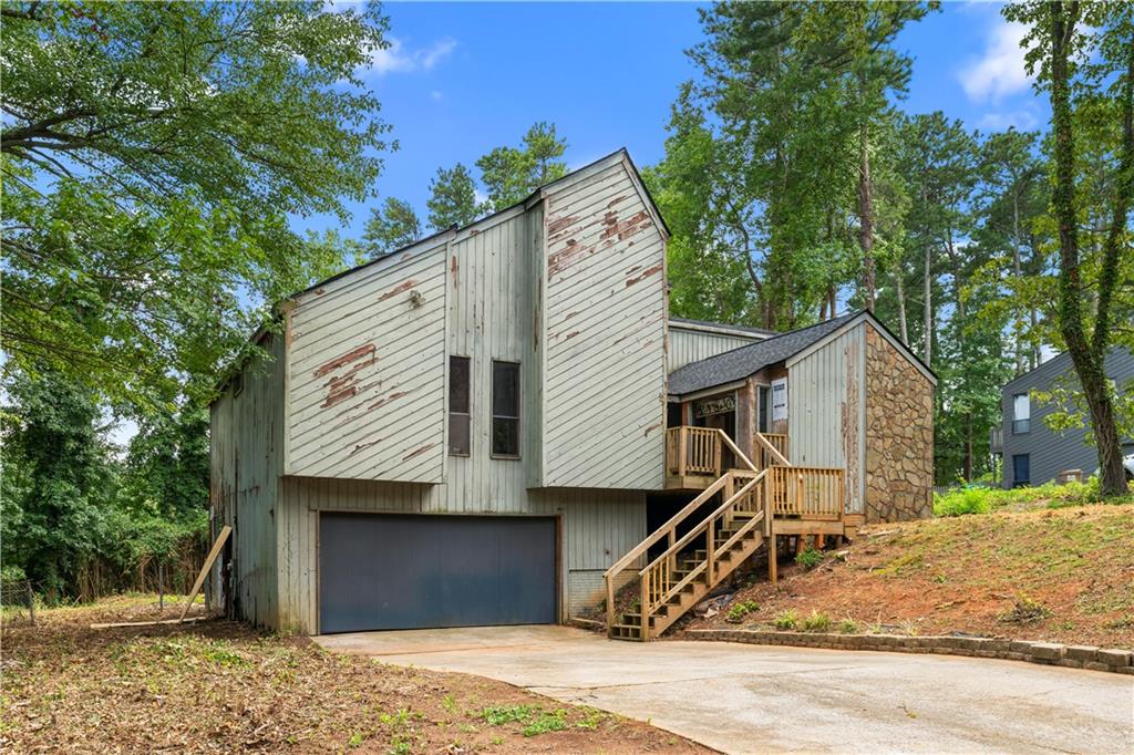 Fixer-upper opportunity in the Pope High School district. This contemporary 3-bed, 2-bath home, located in one of Metro Atlanta’s top school districts, is a great option for an investor or homeowner willing to put in some work. The living area is spacious, and other features include a partial basement, garage, and a large backyard with a patio. Please note: the home is being sold as-is.