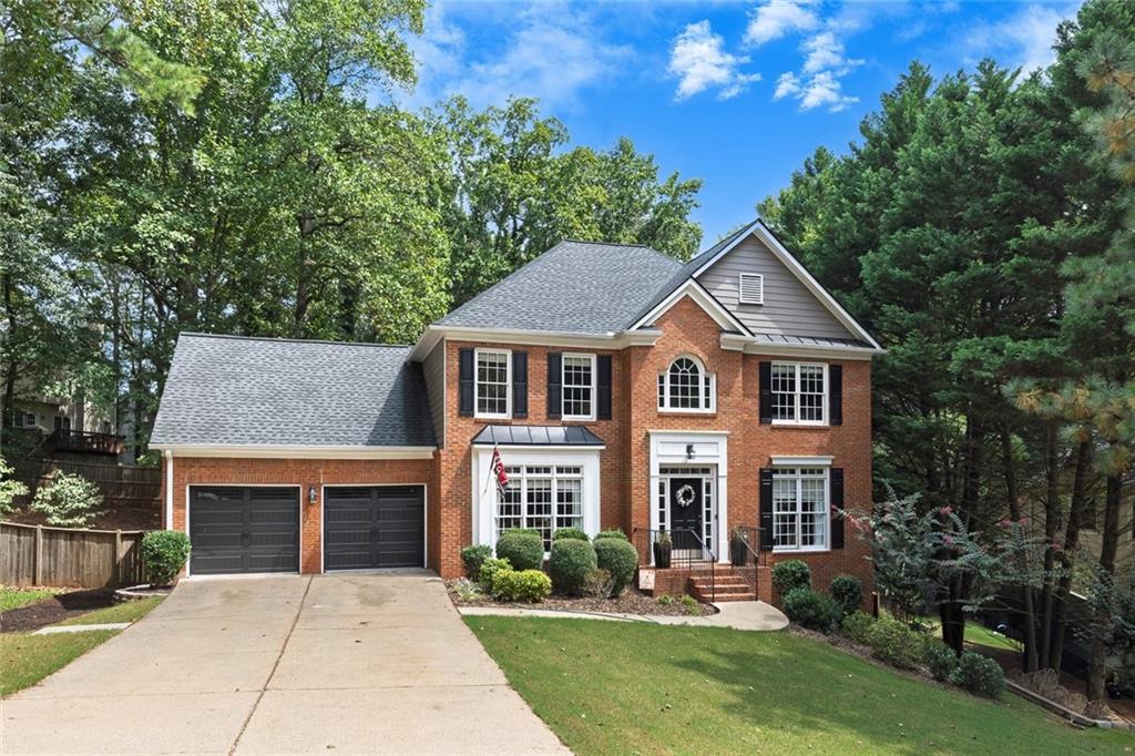 Welcome to this stunning 5-bedroom, 3.5-bath home with over 4,000 sq ft in the highly sought-after Wyngate community of Towne Lake. Nestled on a quiet street, this home features an open kitchen with granite countertops, white cabinetry, stainless steel appliances, and a breakfast bar that flows into the living room and a light-filled keeping room with wet bar. The main level also offers a separate dining room, while upstairs you’ll find generously sized secondary bedrooms and a spacious owner’s suite with a private bath. The fully finished walk-out basement includes a bedroom, full bath, flex space, and large living room—currently an incredible Atlanta Falcons fan cave—perfect for entertaining or guests. Step outside to an expansive deck overlooking the fully fenced private backyard, ideal for gatherings and play. Recent updates include a newer roof, garage doors, and HVAC, giving peace of mind for years to come. Enjoy the unmatched amenities of Wyngate with two pools, clubhouse, tennis and pickleball courts, playgrounds, and community events—all paired with top-rated schools in a prime Towne Lake location.