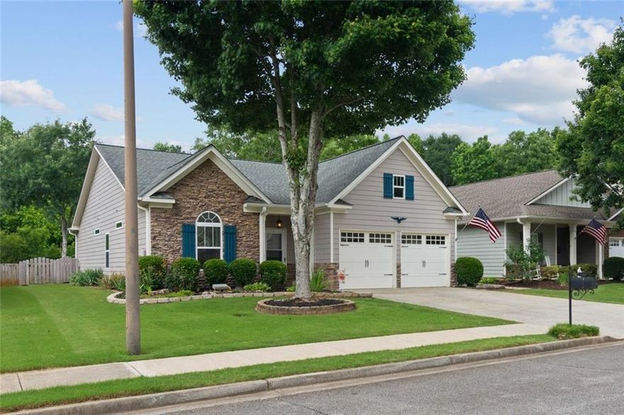 This Stepless 3 bedroom, 2 bath charmer says Welcome Home! Cement siding with stack stone accents just enhances the curb appeal. 2 car garage with carriage style doors. Spacious and open floor plan, lovely entry way with hardwood flooring opens to 9-foot ceilings with upgraded trim and wainscoting throughout. Eat in kitchen with stainless steel appliances, stained cabinets with tile backsplash. There is also a great spot for a coffee or tea nook. Light and airy great room with vaulted ceilings, fireplace with gas logs, views into the dining area and kitchen. Privacy blinds throughout. Primary bedroom is spacious with an updated ensuite with double vanities and stand-alone shower with safety/assistance bars installed. Wheelchair accessible with safety pulls within home. Nicely appointed secondary bedrooms. Right off the family room is a screened in porch with beautiful, vaulted ceilings and exposed beams. The backyard is perfect for entertaining and enjoying the mature landscaping and perennials in bloom. Privacy fence, stone accent pathway adds even more charm to this ranch style home. This one is a keeper