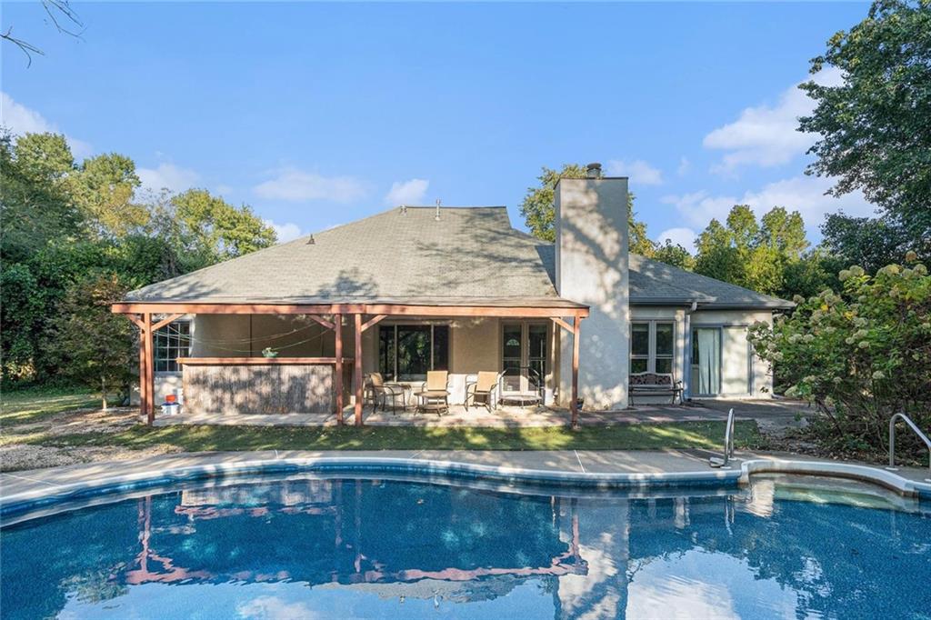 Your private paradise awaits! Dive into the heated, inground saltwater pool, unwind under the cabana, or entertain on the upgraded and extended patio—all within a fully fenced backyard that offers ultimate privacy. This charming 3-bedroom, 2-bath stucco ranch is tucked at the end of a quiet cul-de-sac in the sought-after Friendship Ridge subdivision. A 2-car garage plus an added one-car carport provide plenty of parking. Updates include all-new windows (2024), fresh exterior paint (2024), and recently replaced carpeting throughout the main living areas and bedrooms. The spacious master suite features his-and-hers closets, a jacuzzi tub, double vanity, and tile floors. No HOA and no rental restrictions. A serene, private retreat perfect for relaxing, entertaining, and making memories with family and friends!