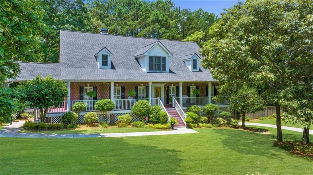 Welcome to this 4-sided executive brick home in the gated community of Helens Manor, ideally situated on a quiet cul-de-sac and a beautifully landscaped 1.53-acre lot. With 6 bedrooms and 5 full baths, this expansive property offers incredible space, function, and privacy—perfect for everyday living and entertaining alike.
A charming front porch sets the tone, while two separate garages provide parking for up to four cars. Step inside to find a soaring living room with vaulted ceilings, skylights, and a cozy fireplace that brings warmth and light to the space. The dedicated dining room is ideal for gatherings, and the kitchen features granite countertops, abundant cabinetry, and plenty of room to cook and connect.
The spacious primary suite is conveniently located on the main level and offers large walk-in closets and a private retreat-like feel. The second bedroom on the main level offers an en-suite bathroom and works perfectly as a home office. Upstairs, you'll find three generously sized secondary bedrooms, and the finished basement includes an additional bedroom and full bath—perfect for a guest suite, home gym, or rec space.
Step outside to your private backyard oasis: a large deck overlooks a fenced, landscaped yard with an inviting, heated, in-ground pool and hot-tub surrounded by mature trees—offering both beauty and privacy.
Don't miss this rare opportunity to own a home with space, style, and amenities in a sought-after gated community.
Enjoy top rated schools, bustling downtown Lawrenceville, and just minutes away from award-winning Tribble Mill Park, this home offers easy access to one of Gwinnett County’s most scenic outdoor destinations. Enjoy over 700 acres of natural beauty, including a stunning lake, miles of walking and biking trails, fishing spots, and family-friendly playgrounds. Whether you're into kayaking, picnicking, or simply soaking up nature, Tribble Mill Park provides the perfect backdrop for an active and relaxed lifestyle—right in your backyard.